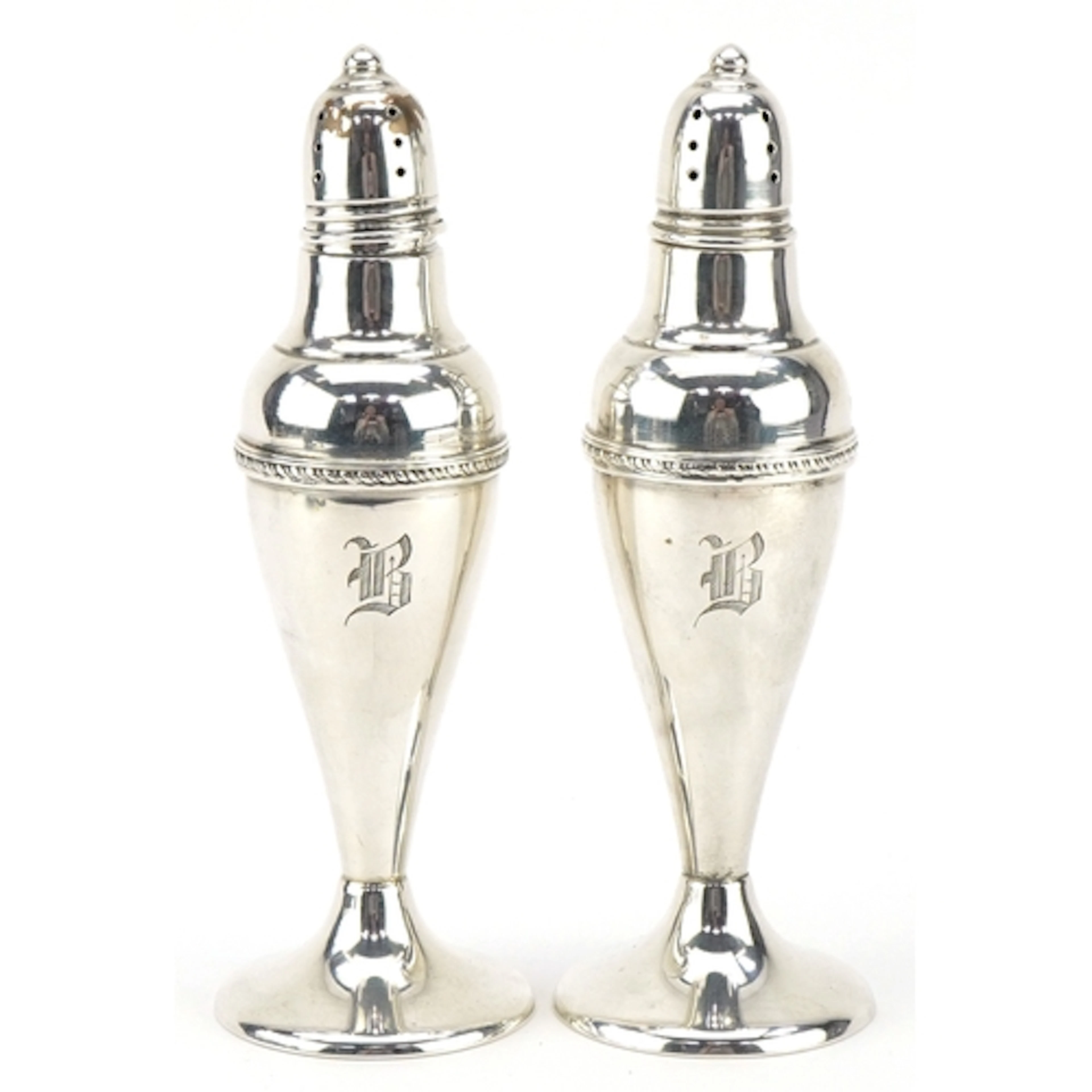 A pair of Arts & Crafts style American sterling silver caste...