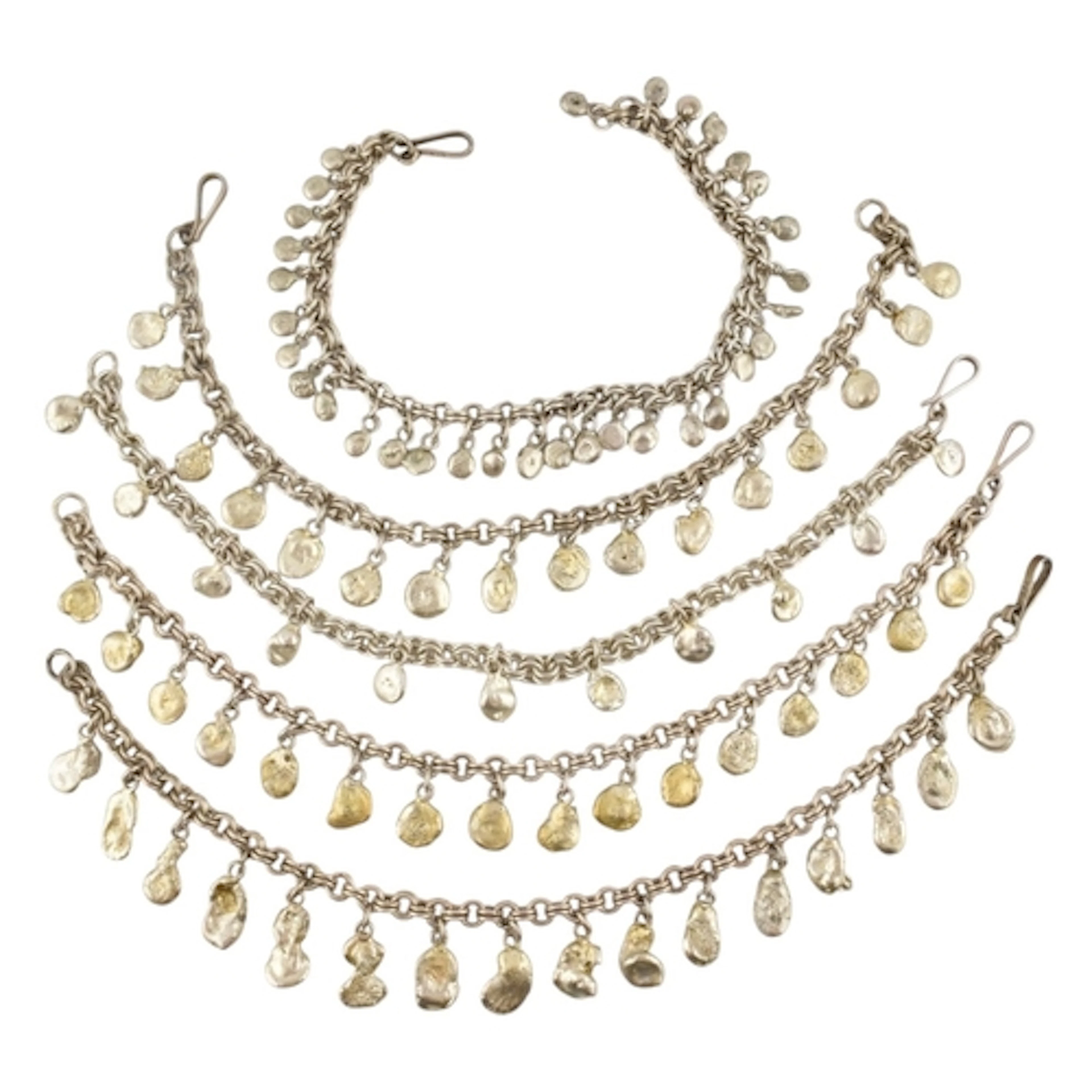 A collection of contemporary silver white metal pebble strun...