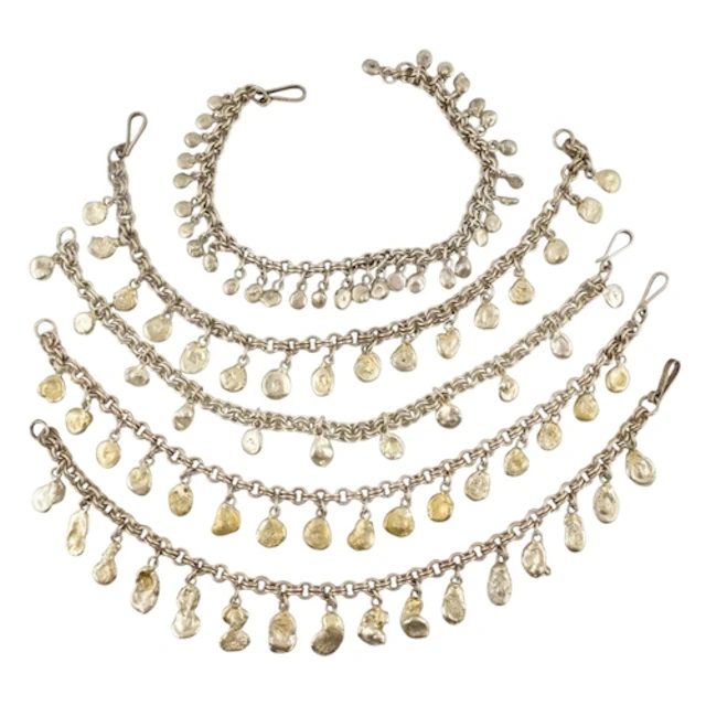 A collection of contemporary silver white metal pebble strun...