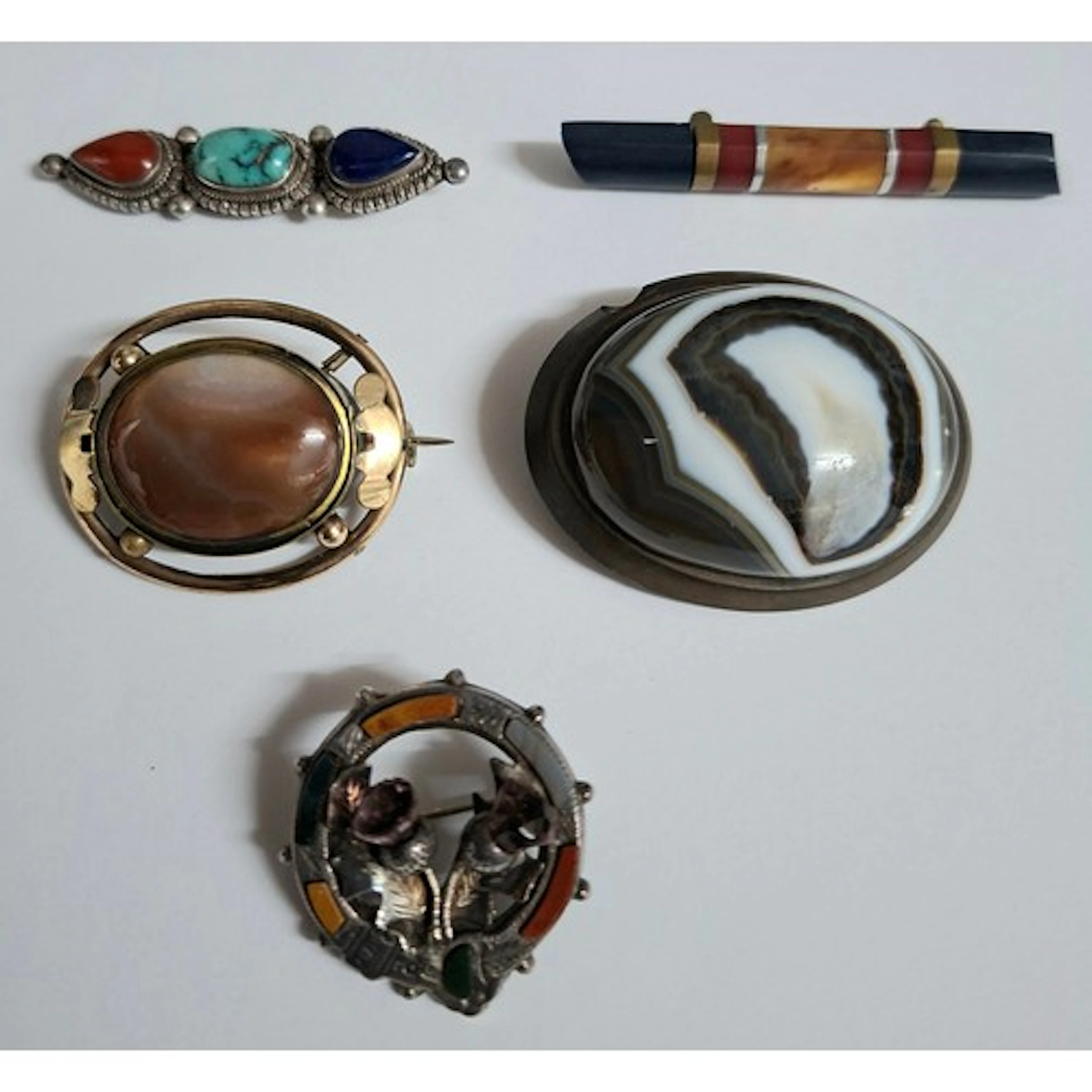 Five Victorian and later brooches to include a Pinchbeck and...