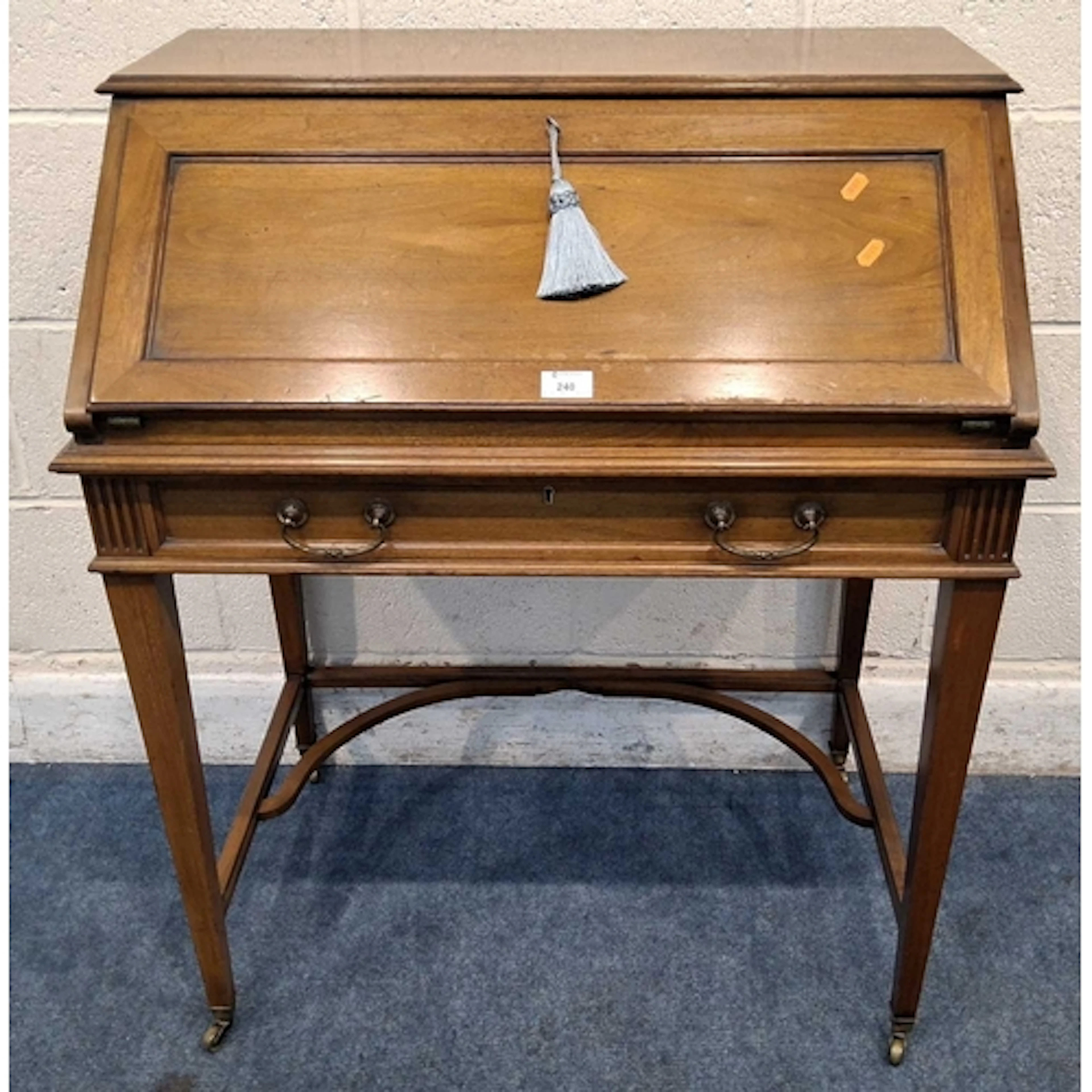 A REPRODUCTION WALNUT BUREAU, the fall front door enclosing ...