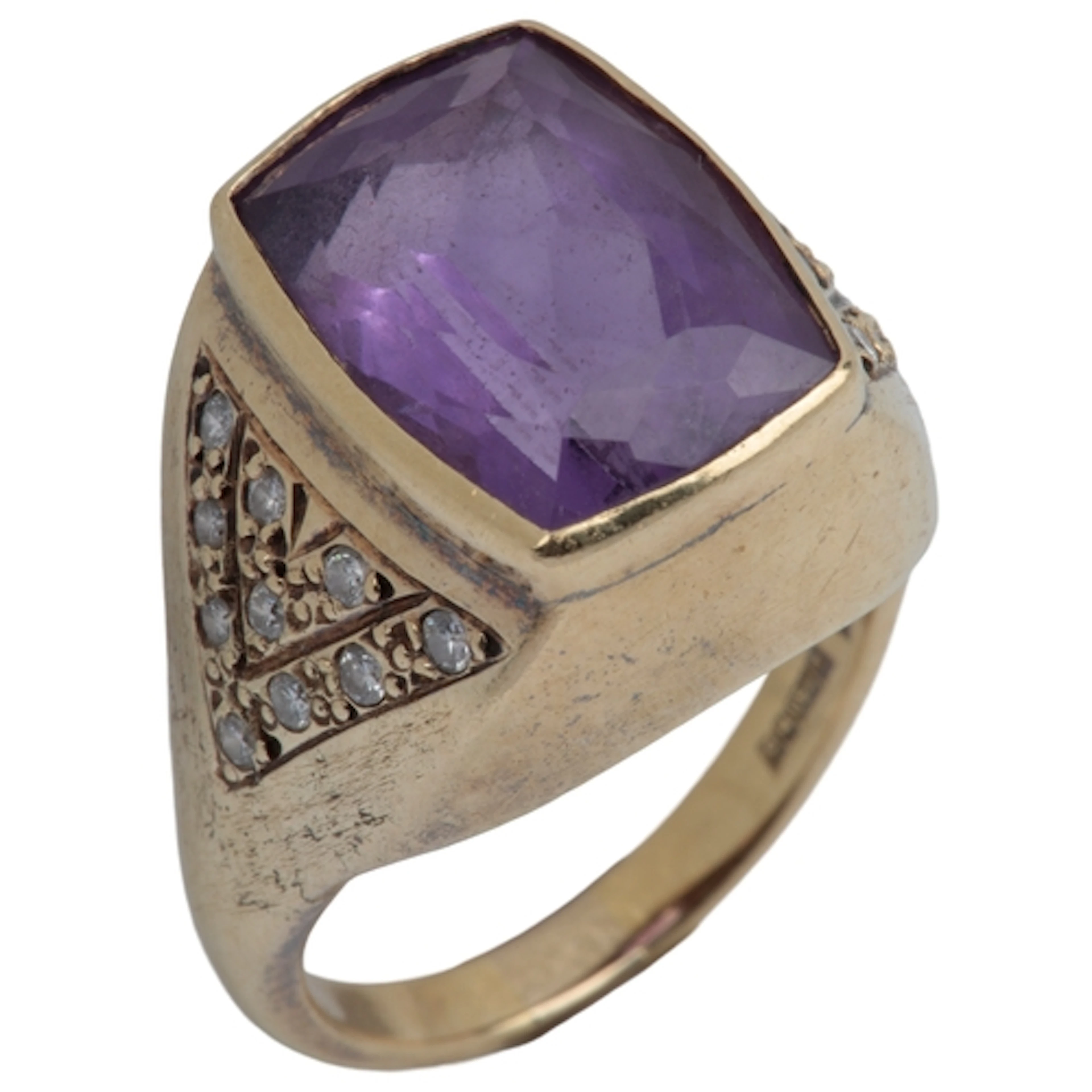 An amethyst and diamond ring, collet-set with an elongated c...