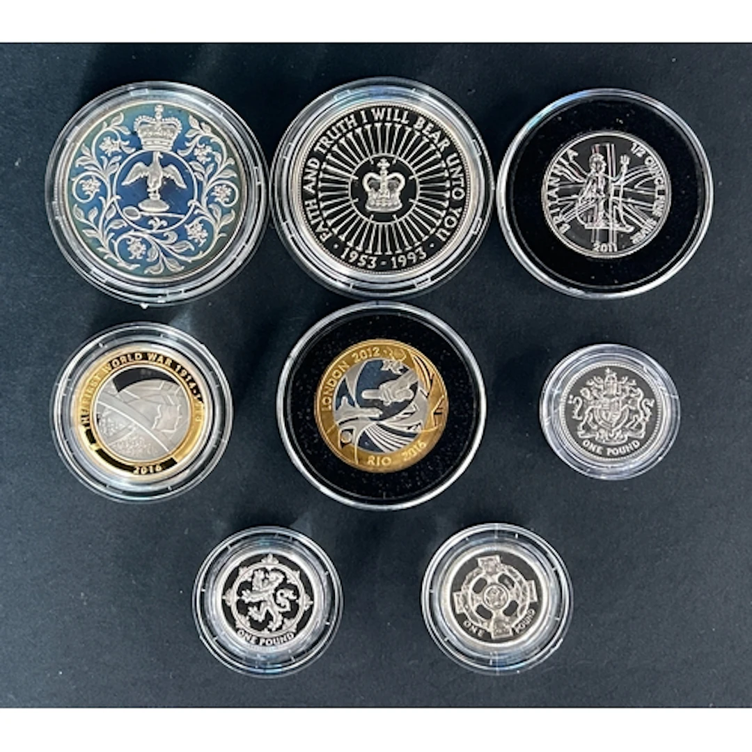 A group of eight UK QEII silver proof coins, comprising silv...