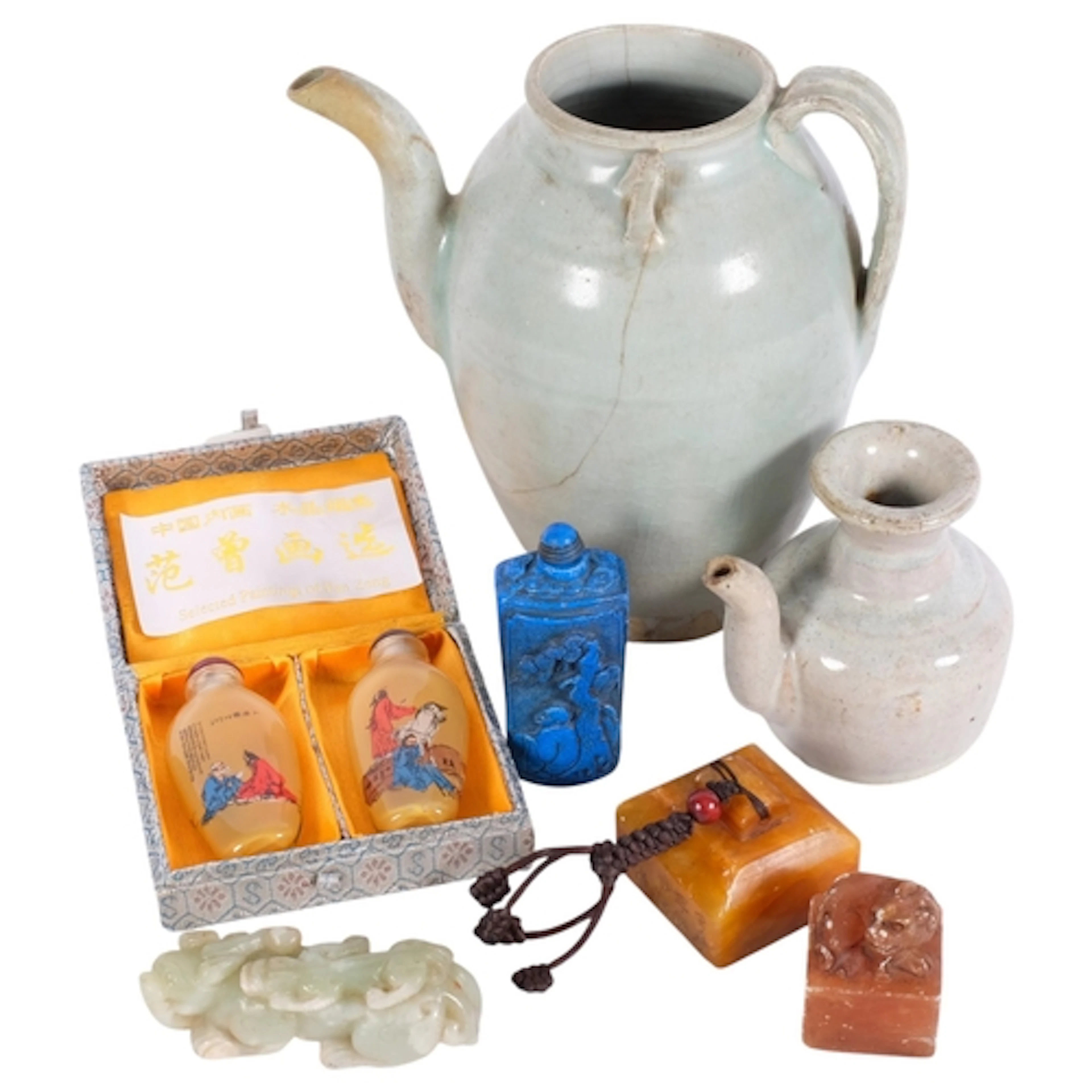 A group of Chinese stone carvings, including a pale green ja...