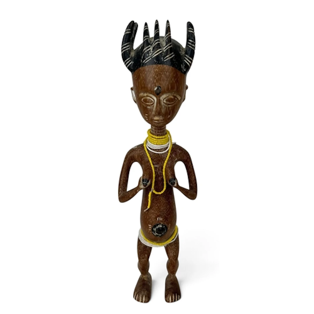 AN AFRICAN TRIBAL CARVED WOODEN FIGURE In the form of femal ...