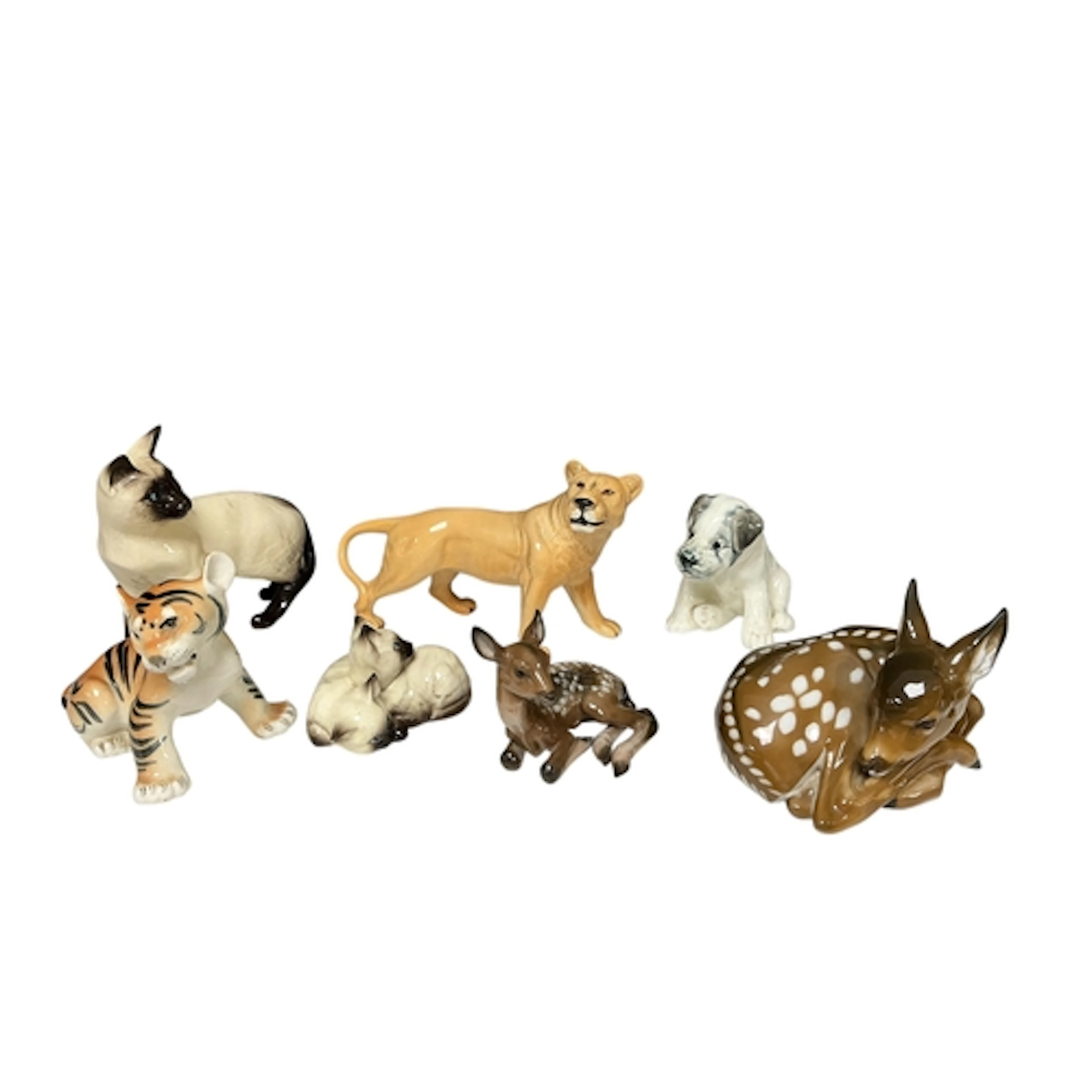 A collection of seven porcelain model animals to include a R...