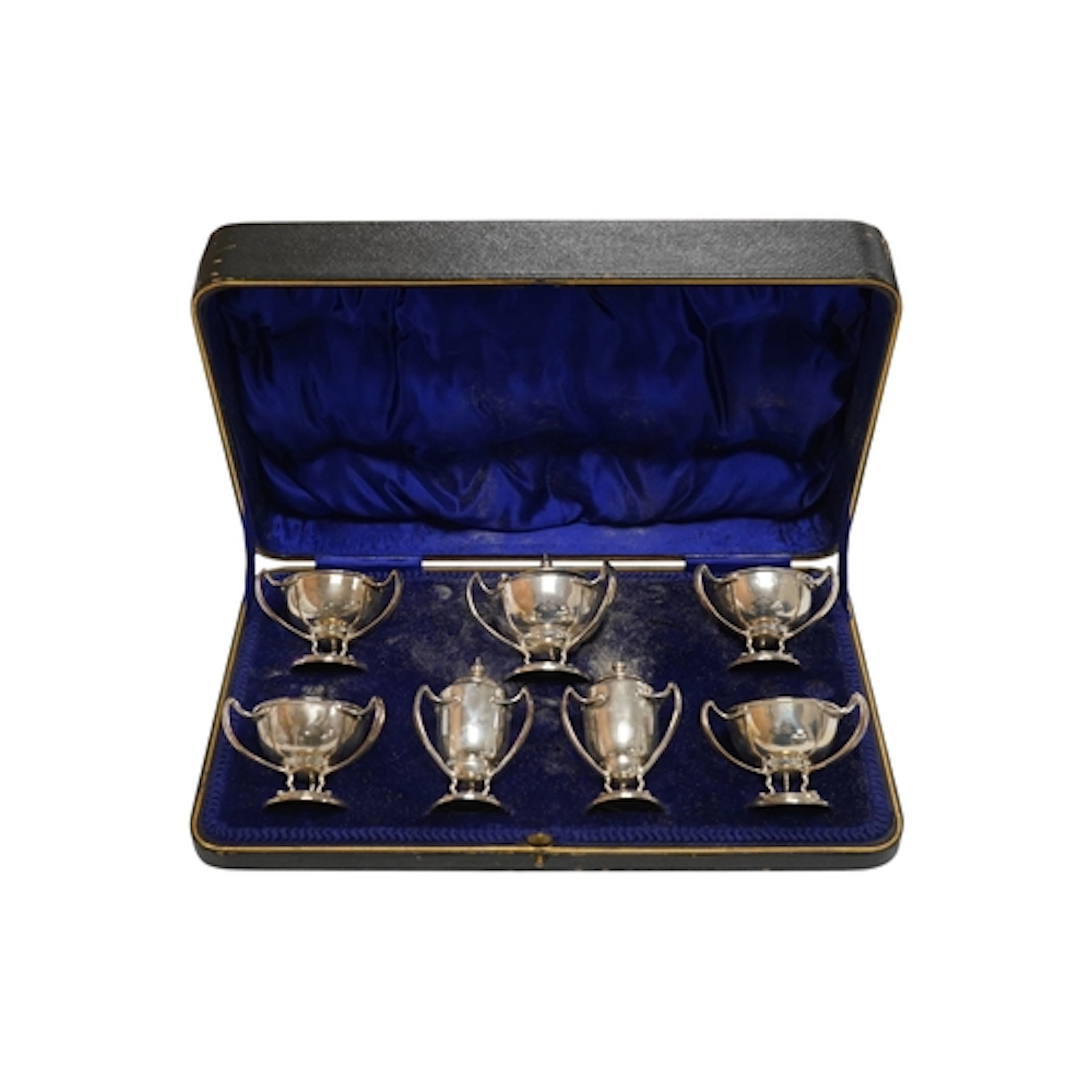 A cased Edwardian Art Nouveau silver seven piece condiment s...