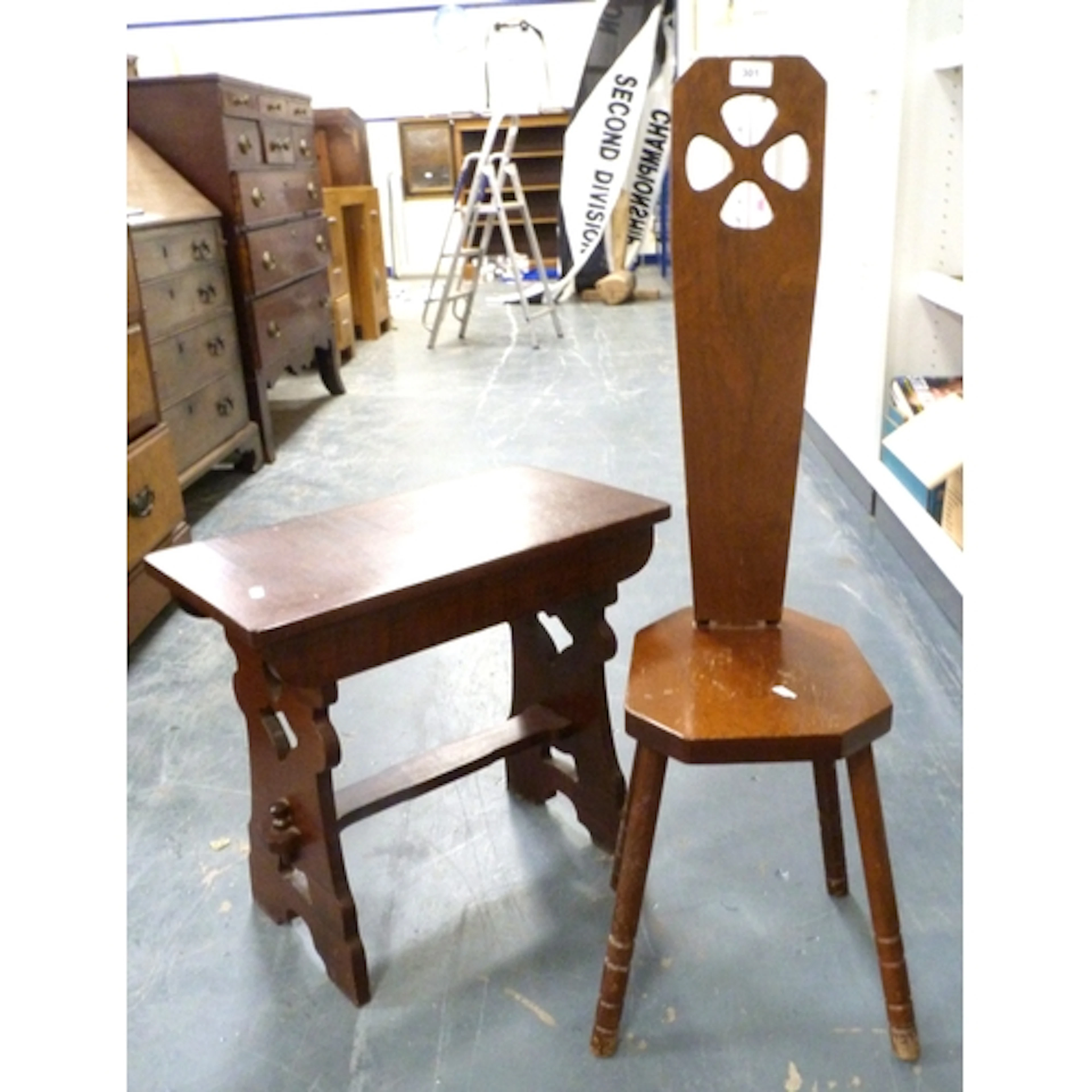 Spinning chair and a trestle end occasional table. (2)