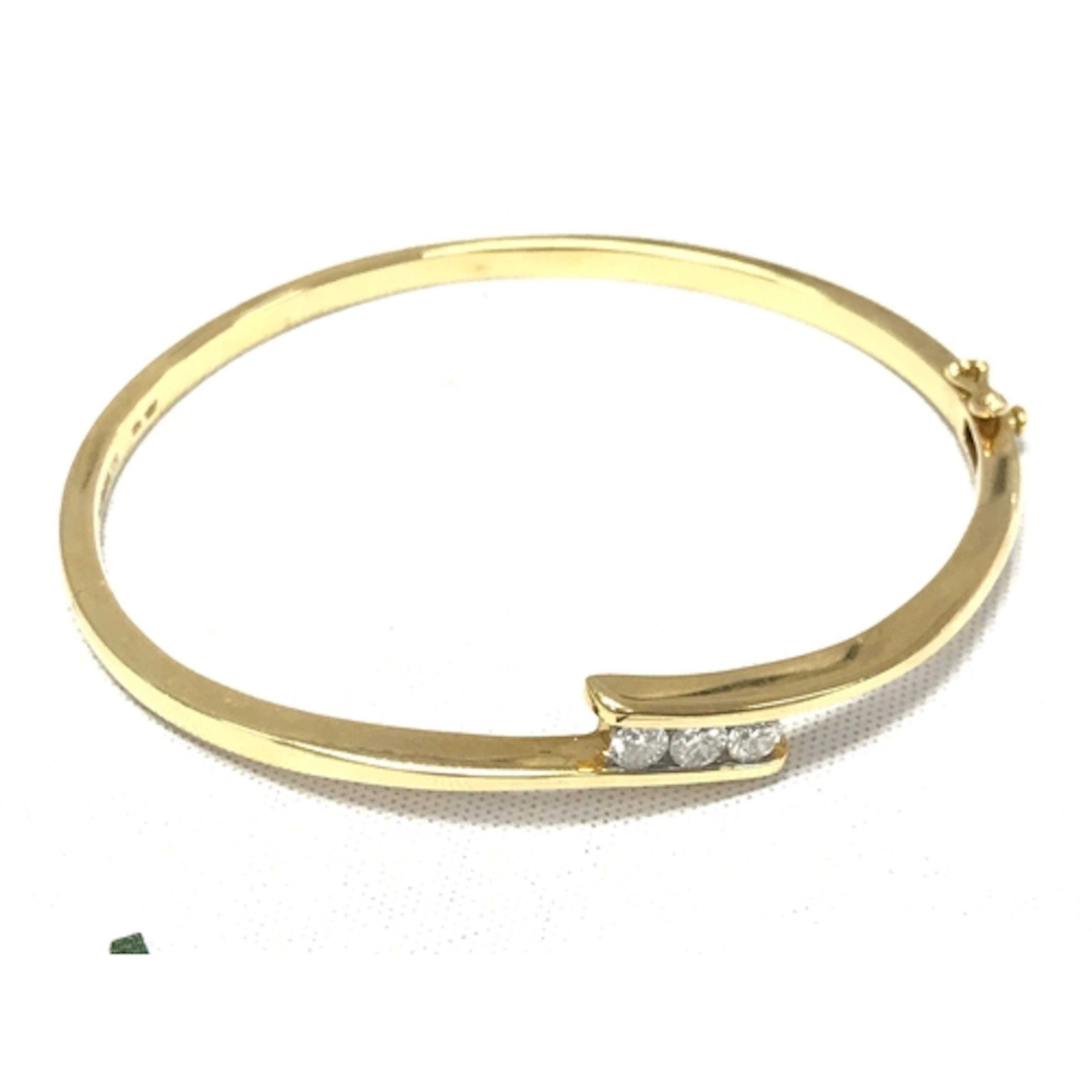 An 18ct gold diamond bangle with a certificate. 6.5cm wide, ...