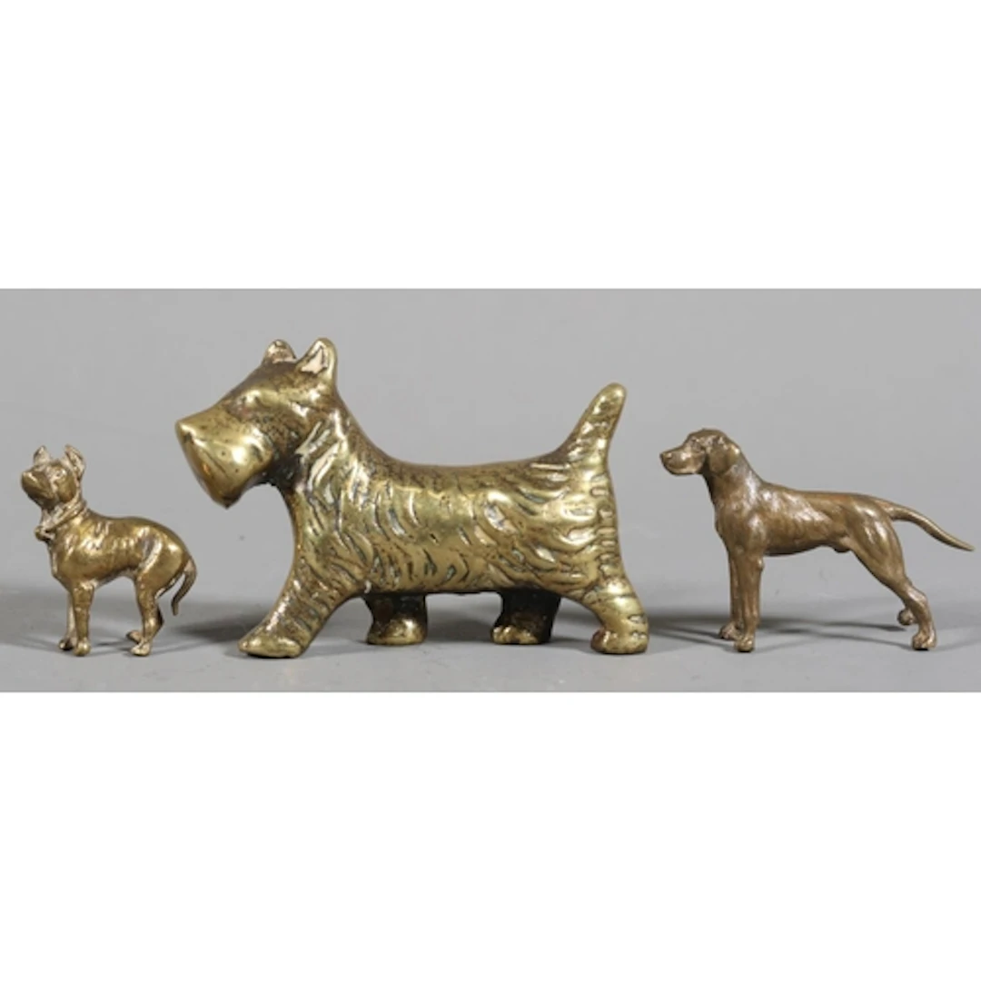 Three miniature dog models to include brass Scottish terrier...