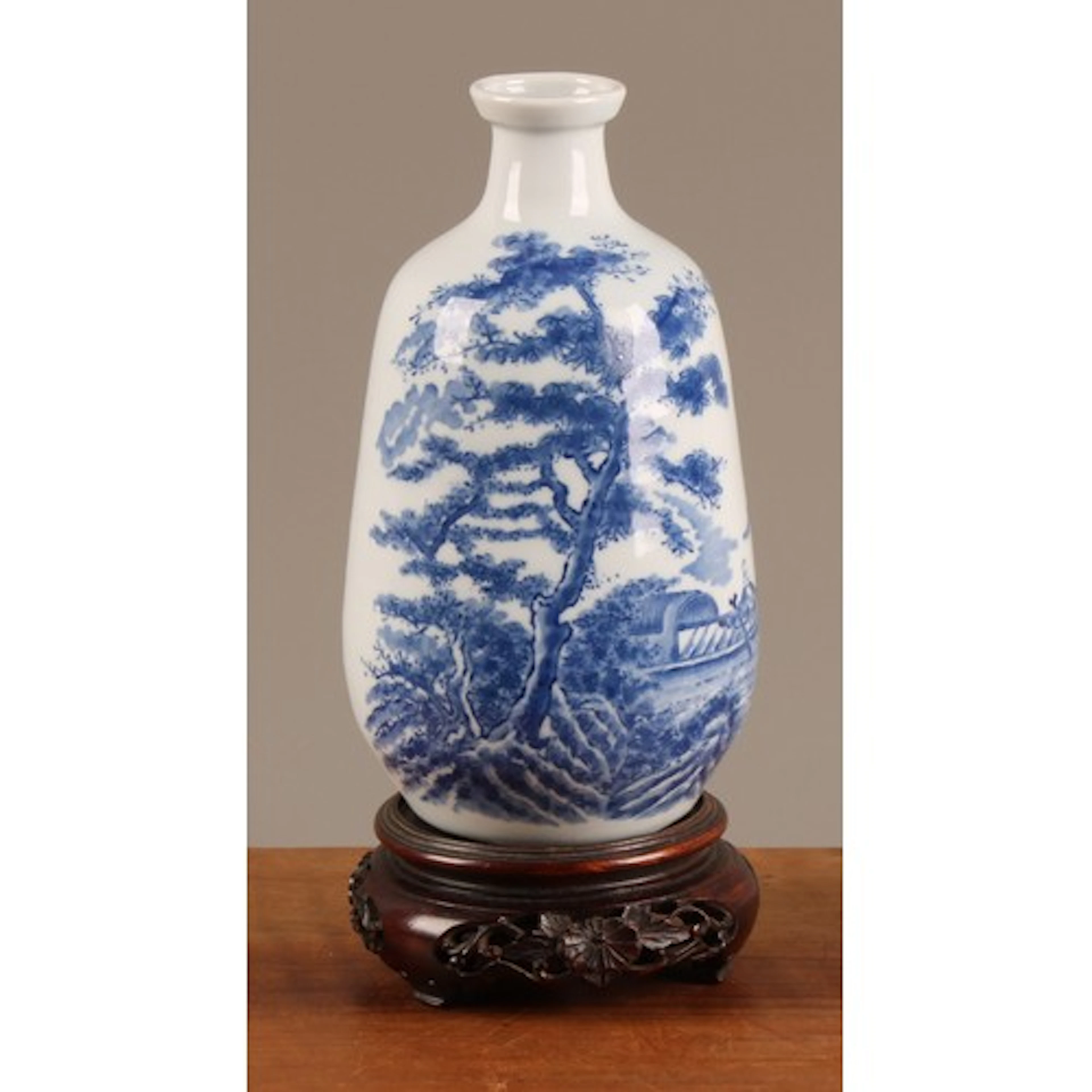 A Japanese porcelain ovoid vase, painted in tones of undergl...