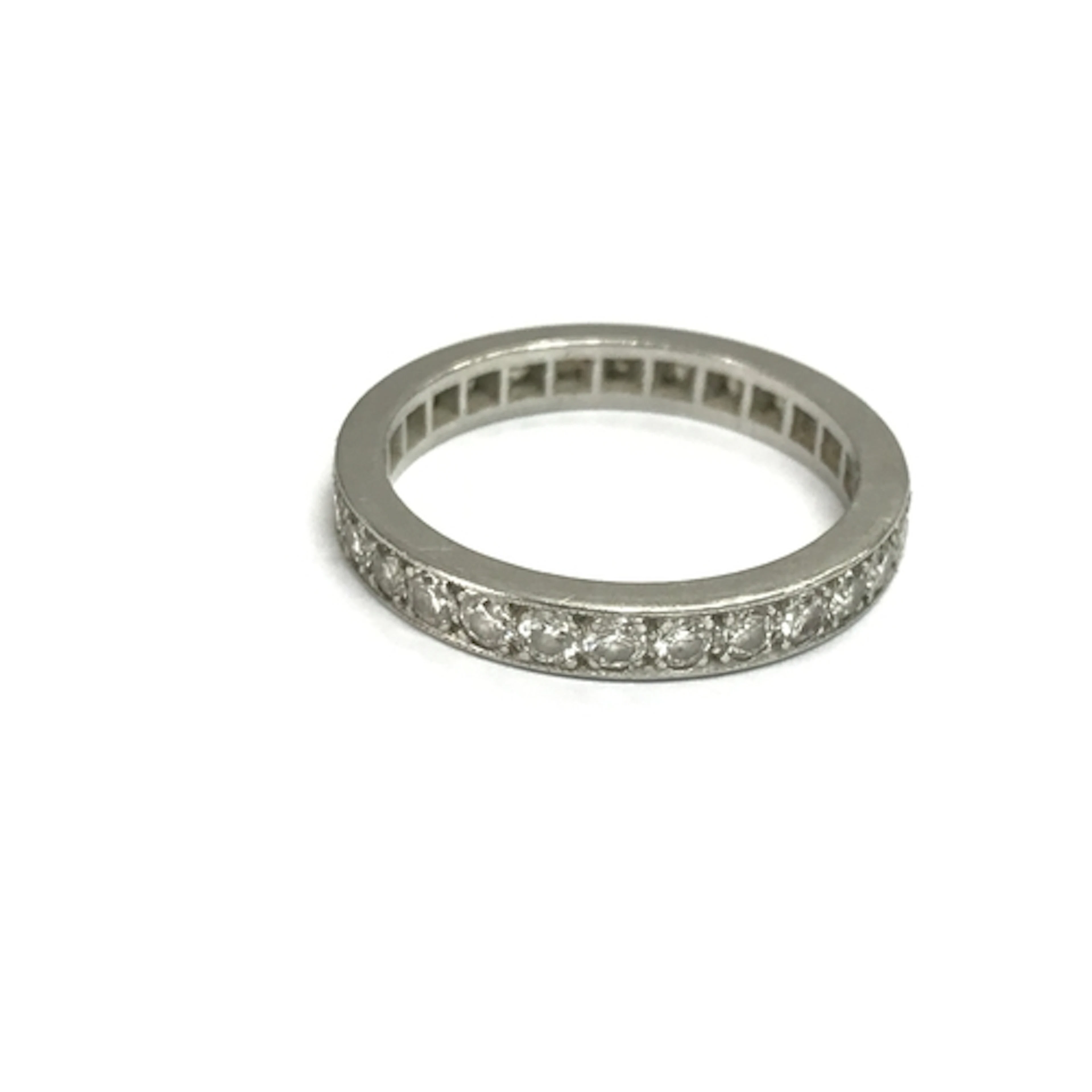 An unmarked white gold eternity ring. Size P 1/2 and 4.82g