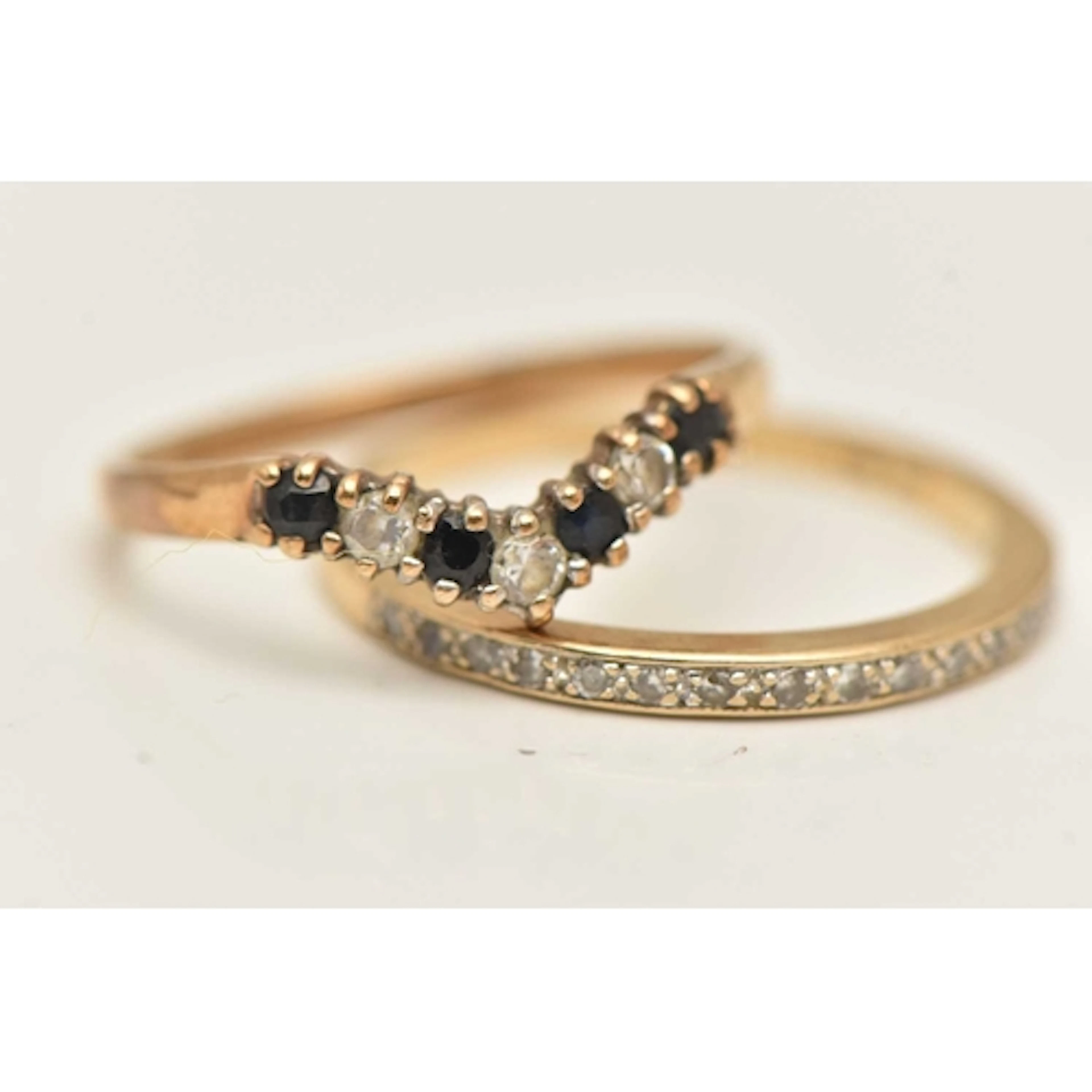 TWO GEM SET RINGS, the first a 9ct gold diamond half eternit...