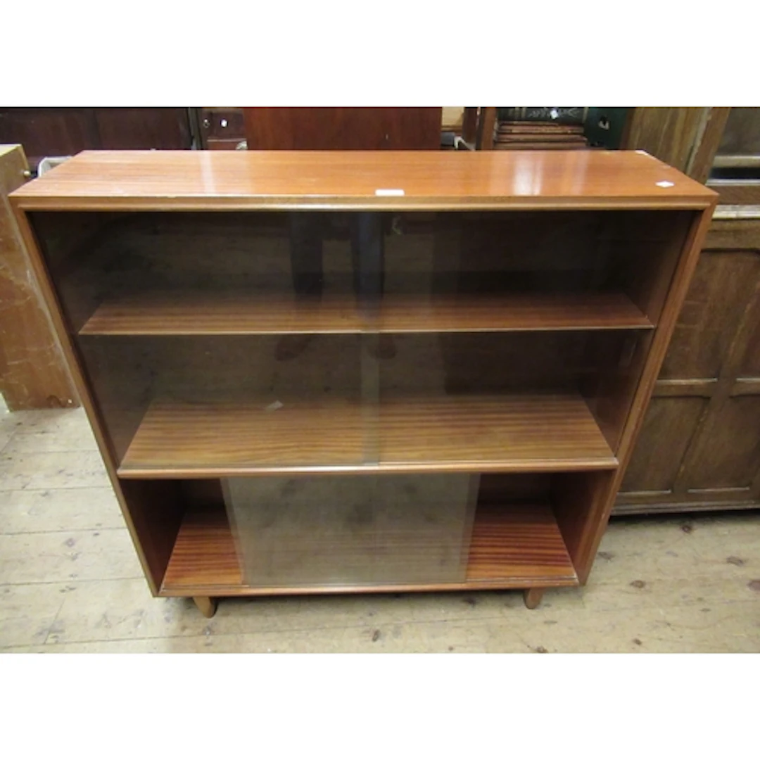 Beaver and Tapley teak glazed bookcase, with a matching bure...