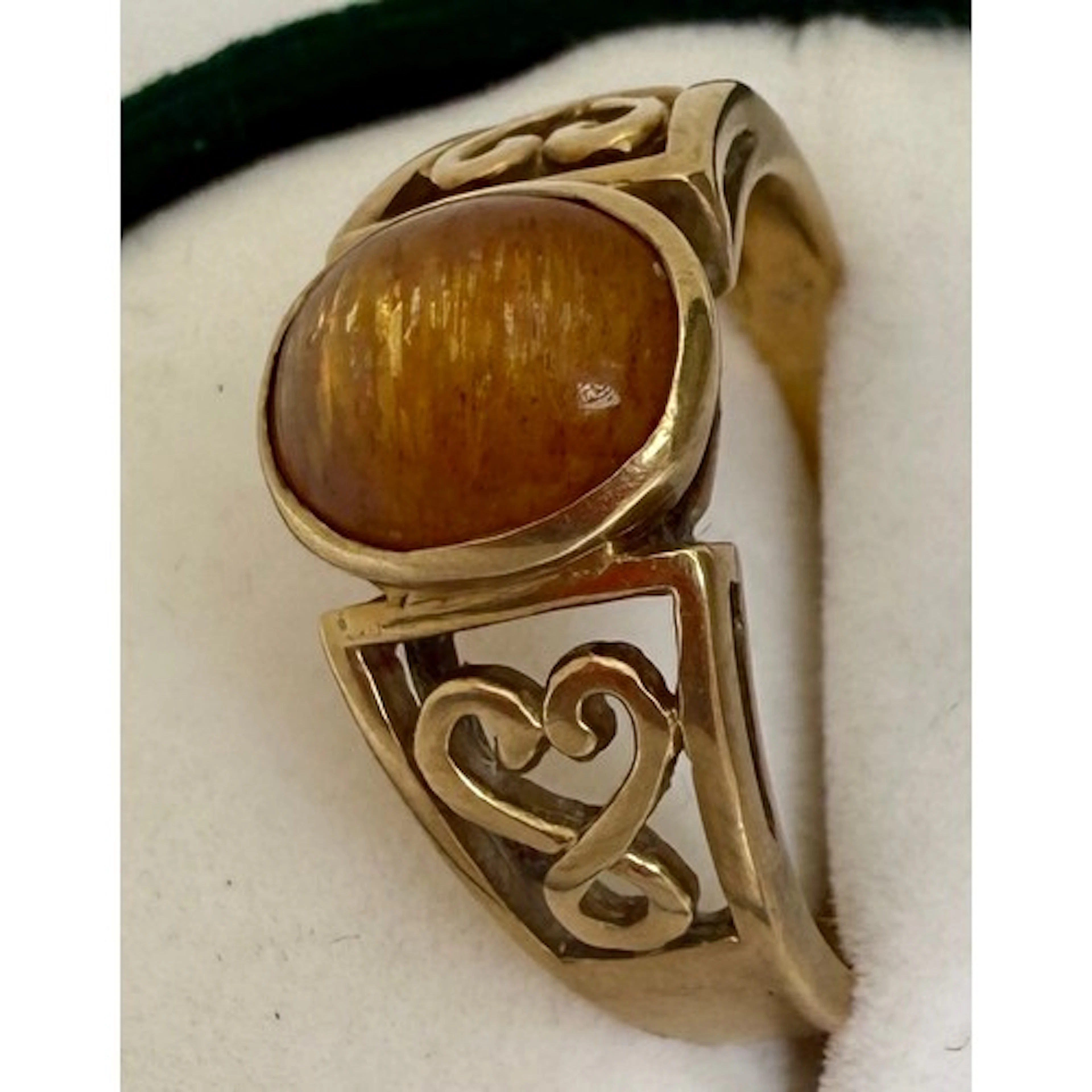 A 9 carat gold ring set with star sunstone with certificate ...