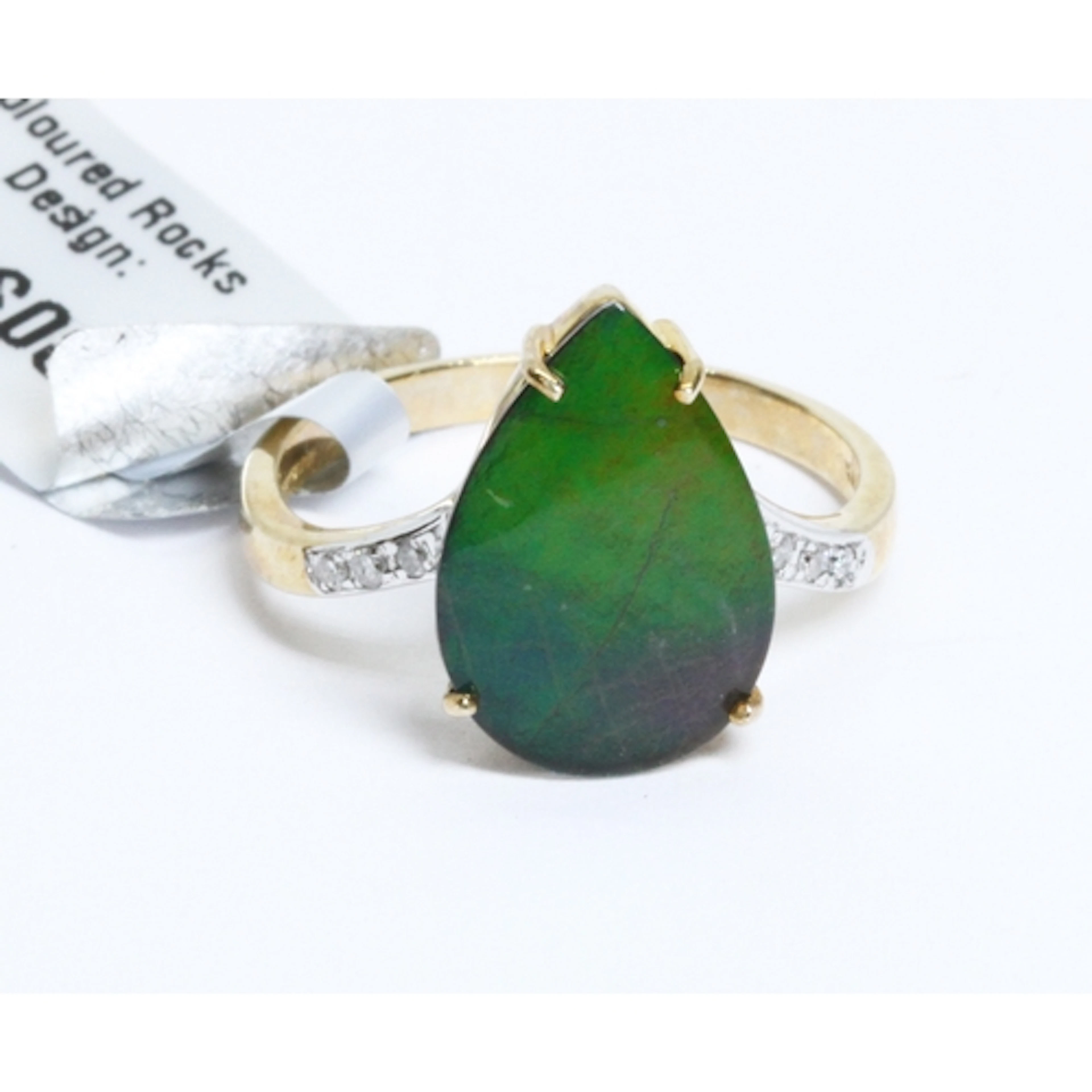 A hallmarked 9ct gold ammolite triplet and diamond ring, gro...