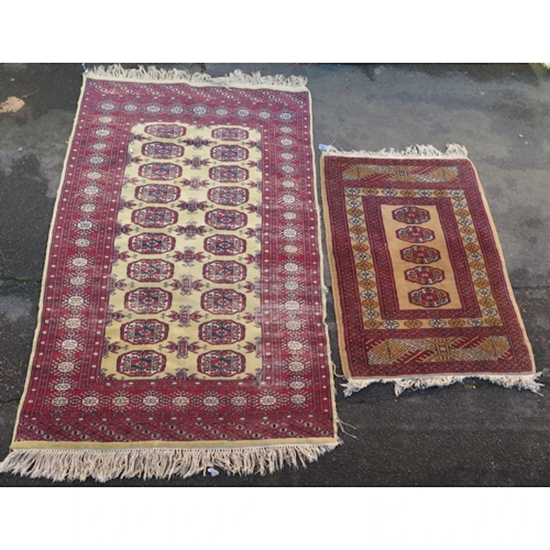 A Turkomen rug, the ivory field with two rows of lozenge med...