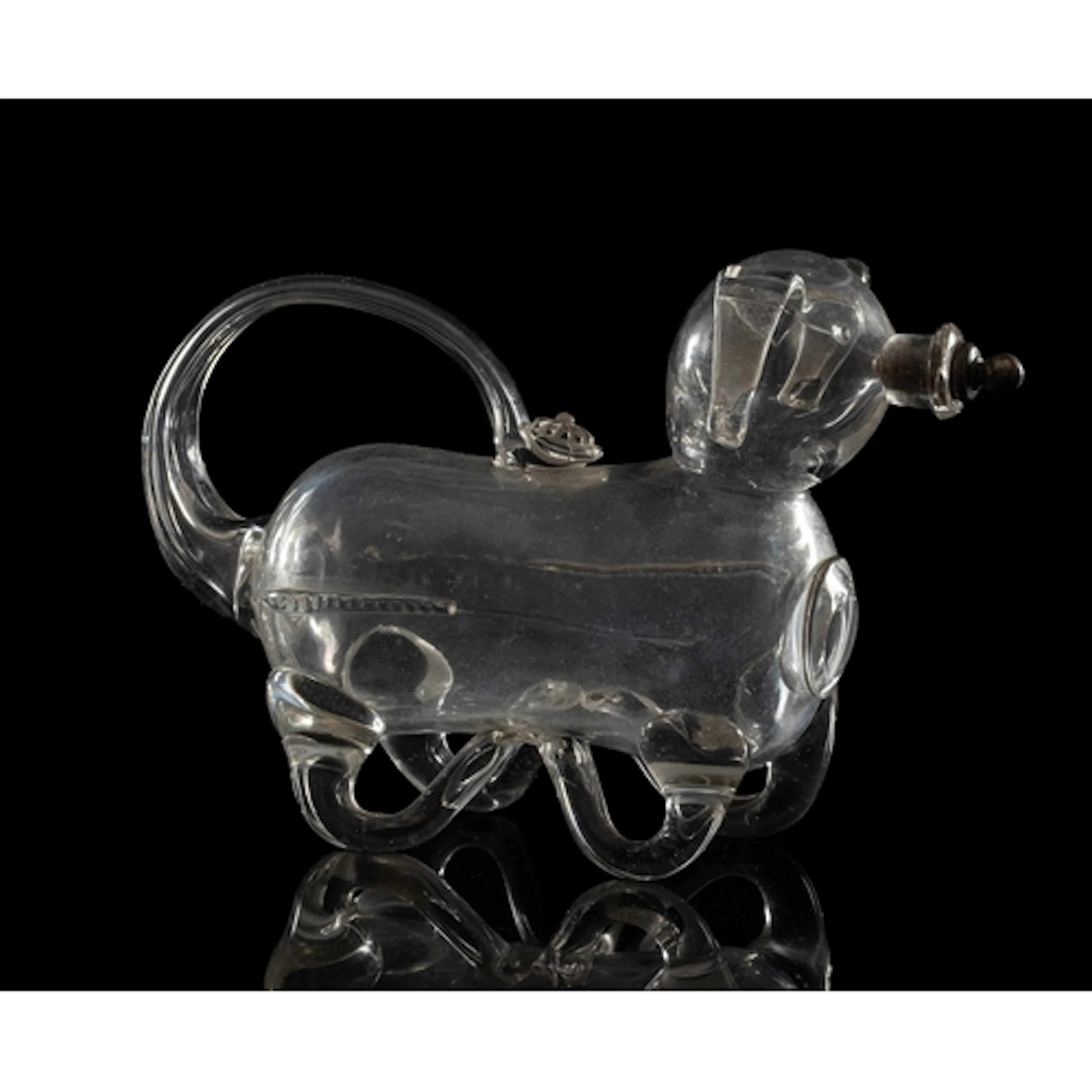 A 19th century novelty glass decanter in the form of a pig, ...