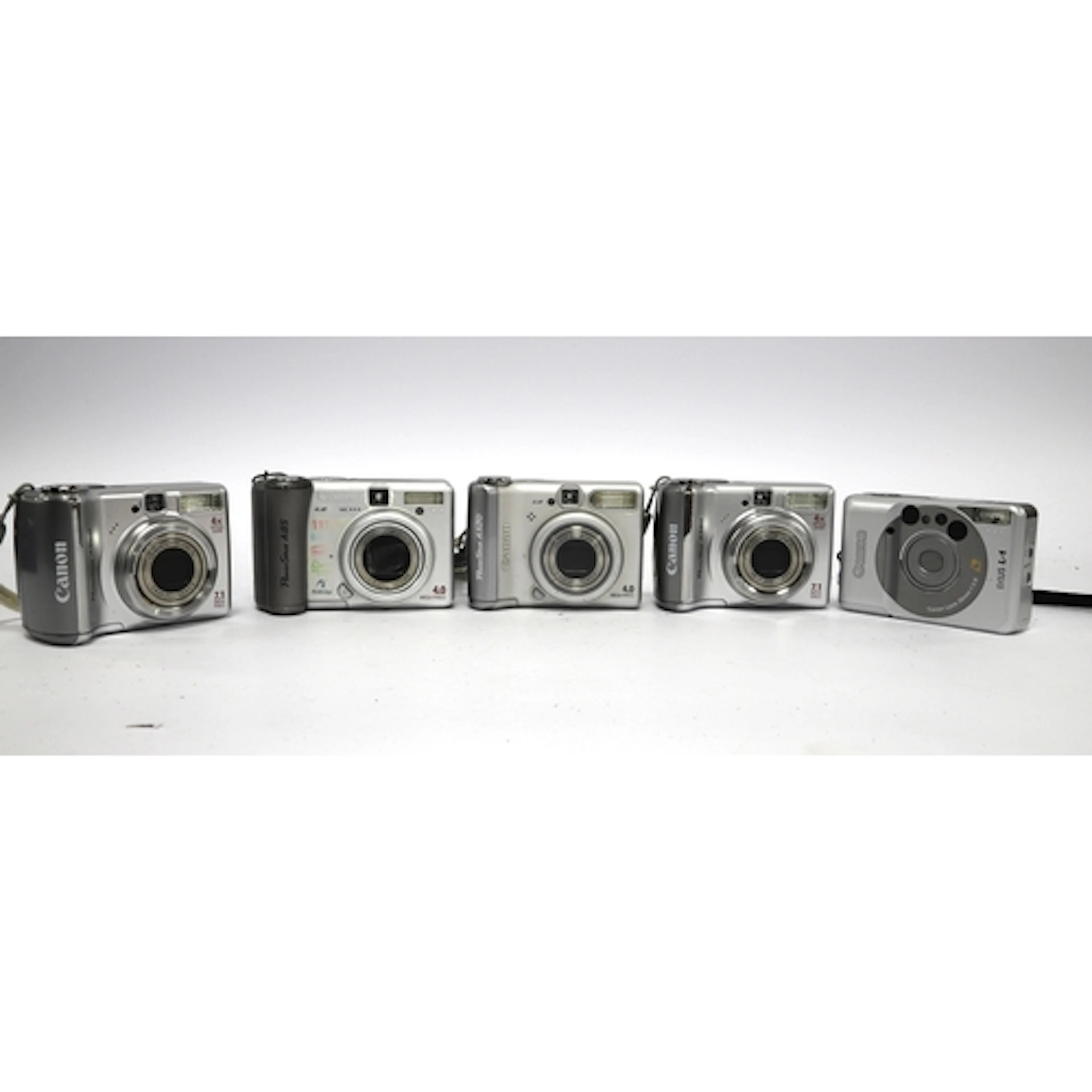 Canon PowerShot Digital Compact Cameras to include two A560,...