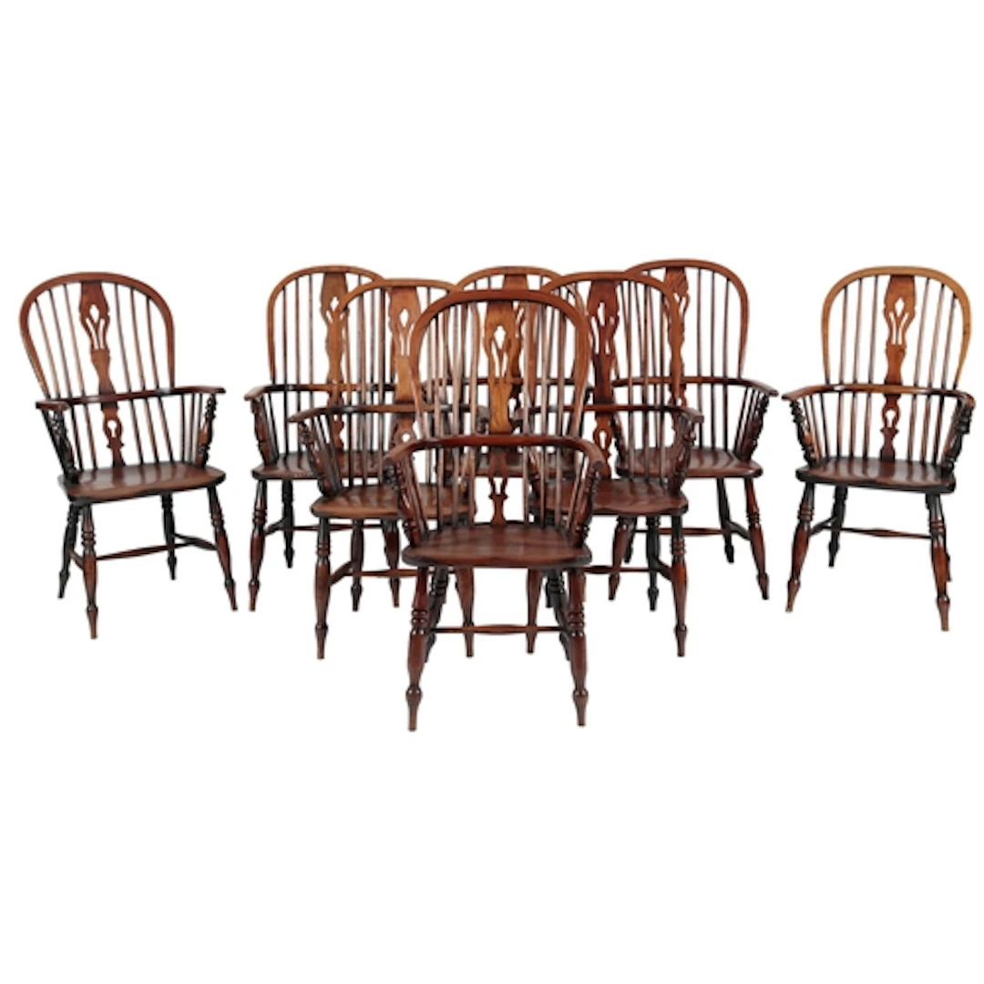 A harlequin set of eight elm Thames Valley Windsor armchairs...