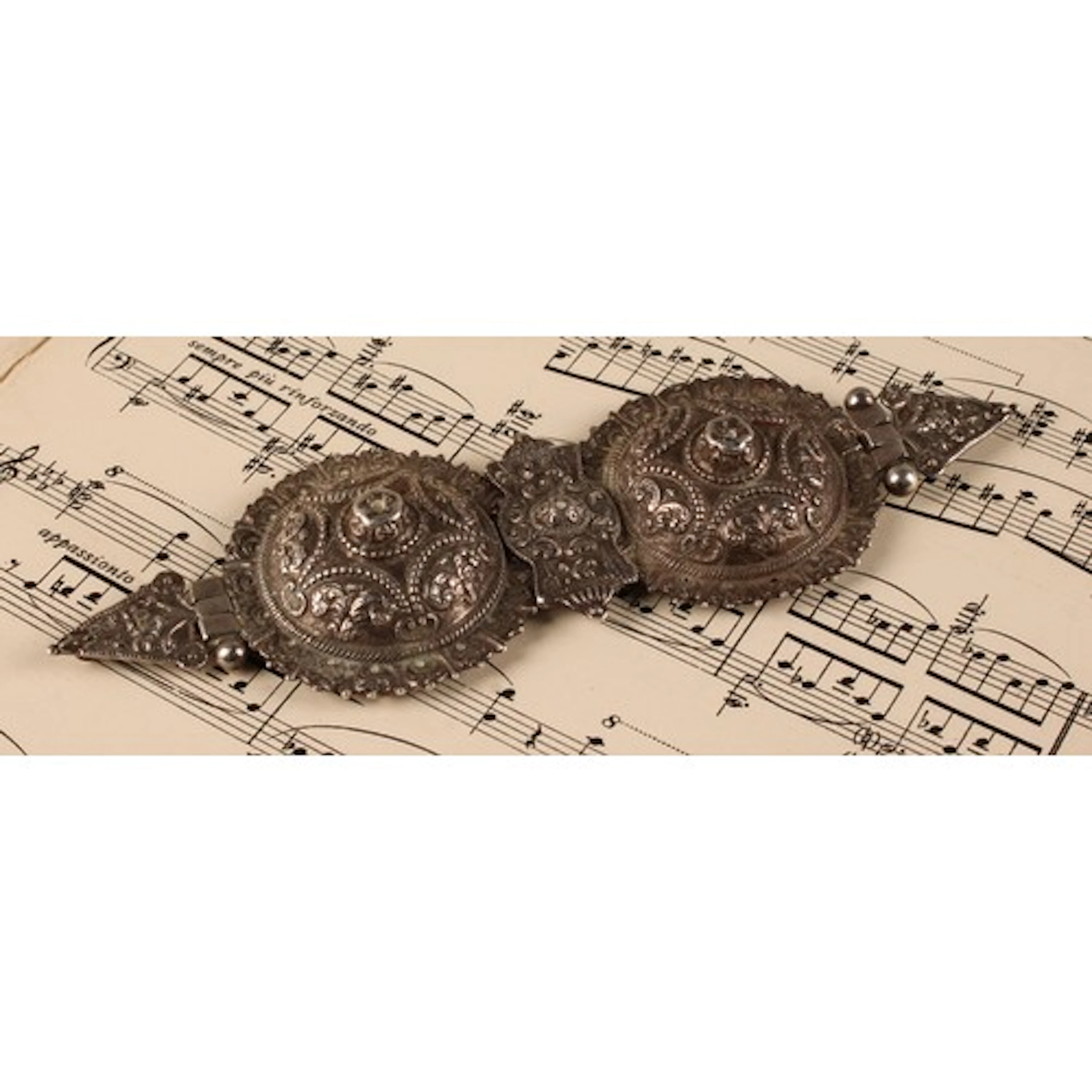 A Victorian silver cloak fastener or buckle in the Persian t...