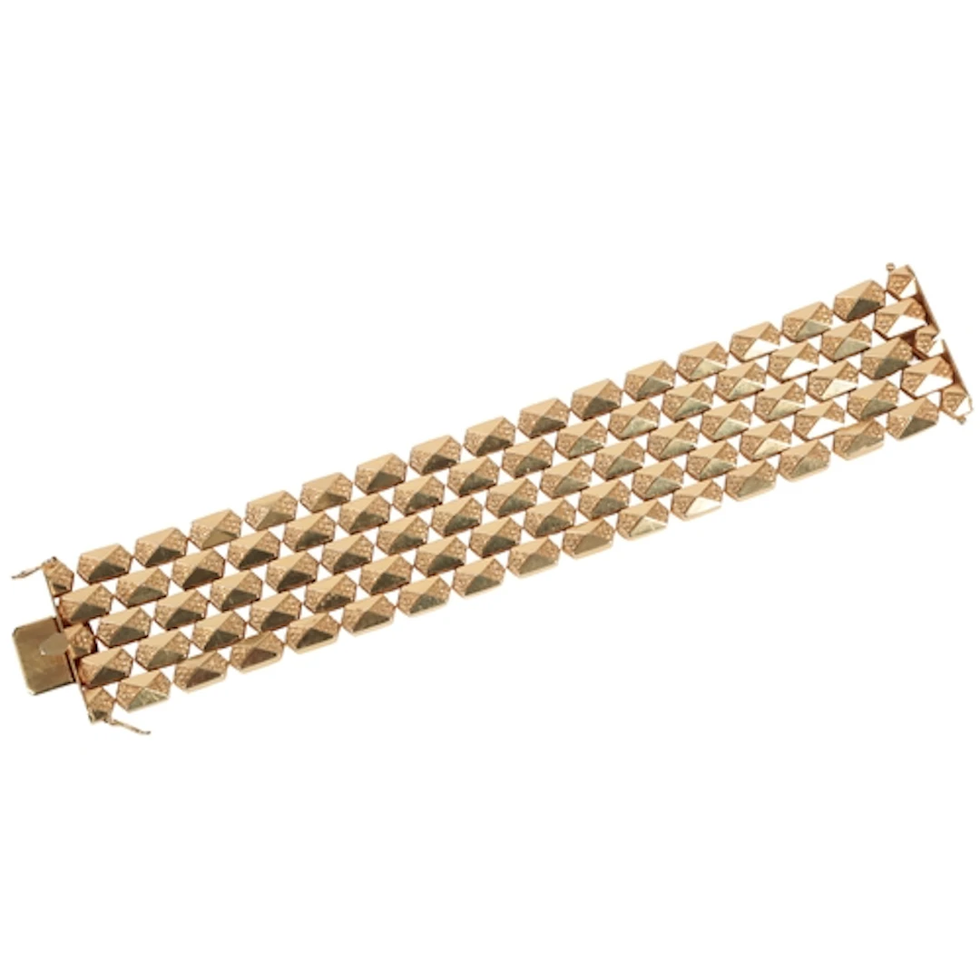 A gold bracelet, Italy, mid 20th century, composed of elonga...