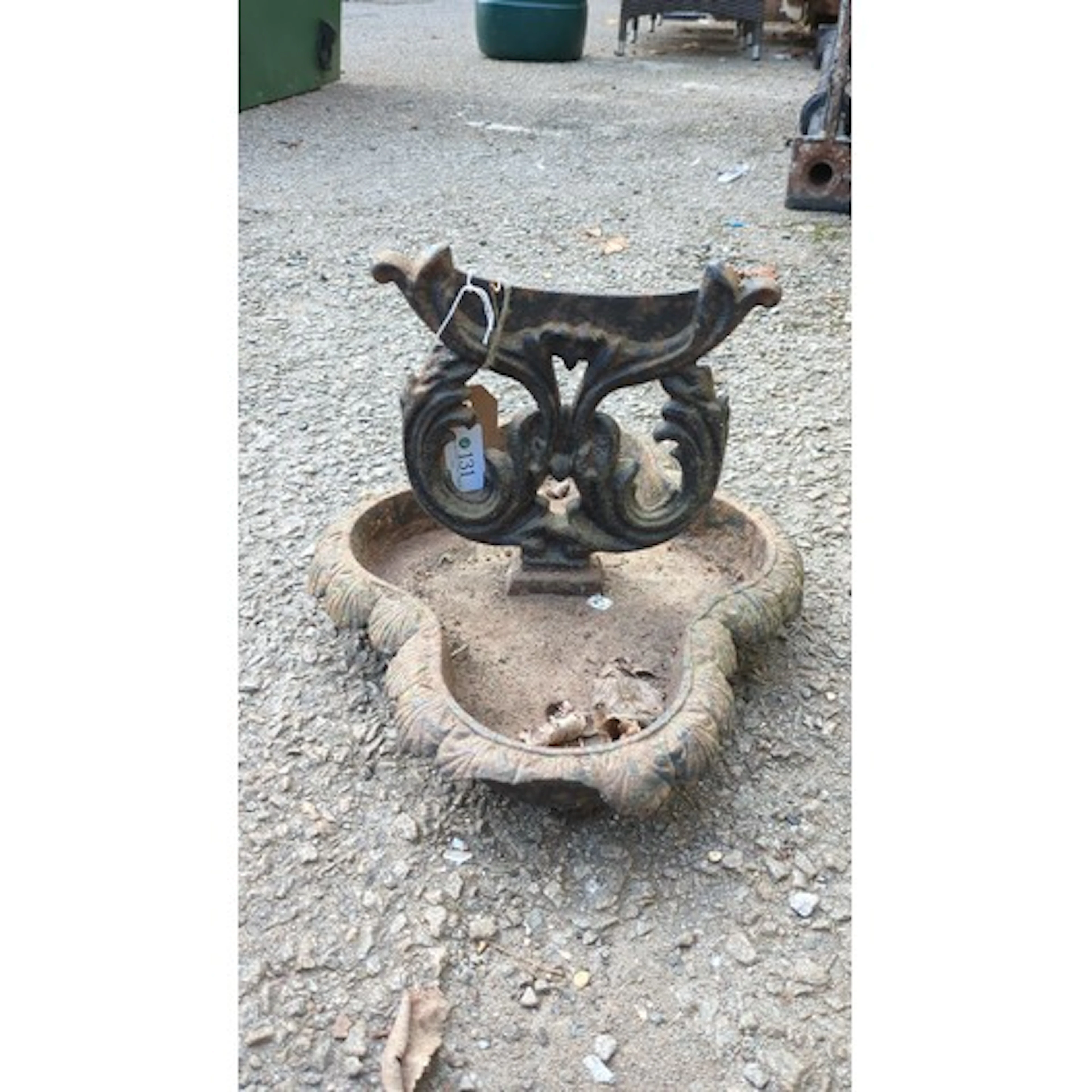 Cast iron boot scraper with scrolling foliate uprights suppo...