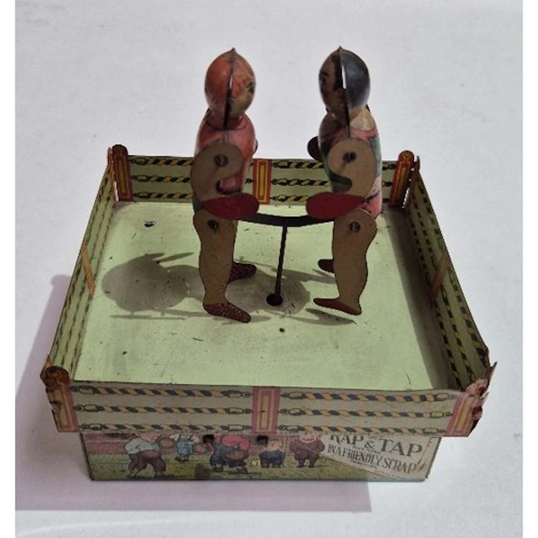 A Unique Art tin clockwork Rap & Tap boxing toy.