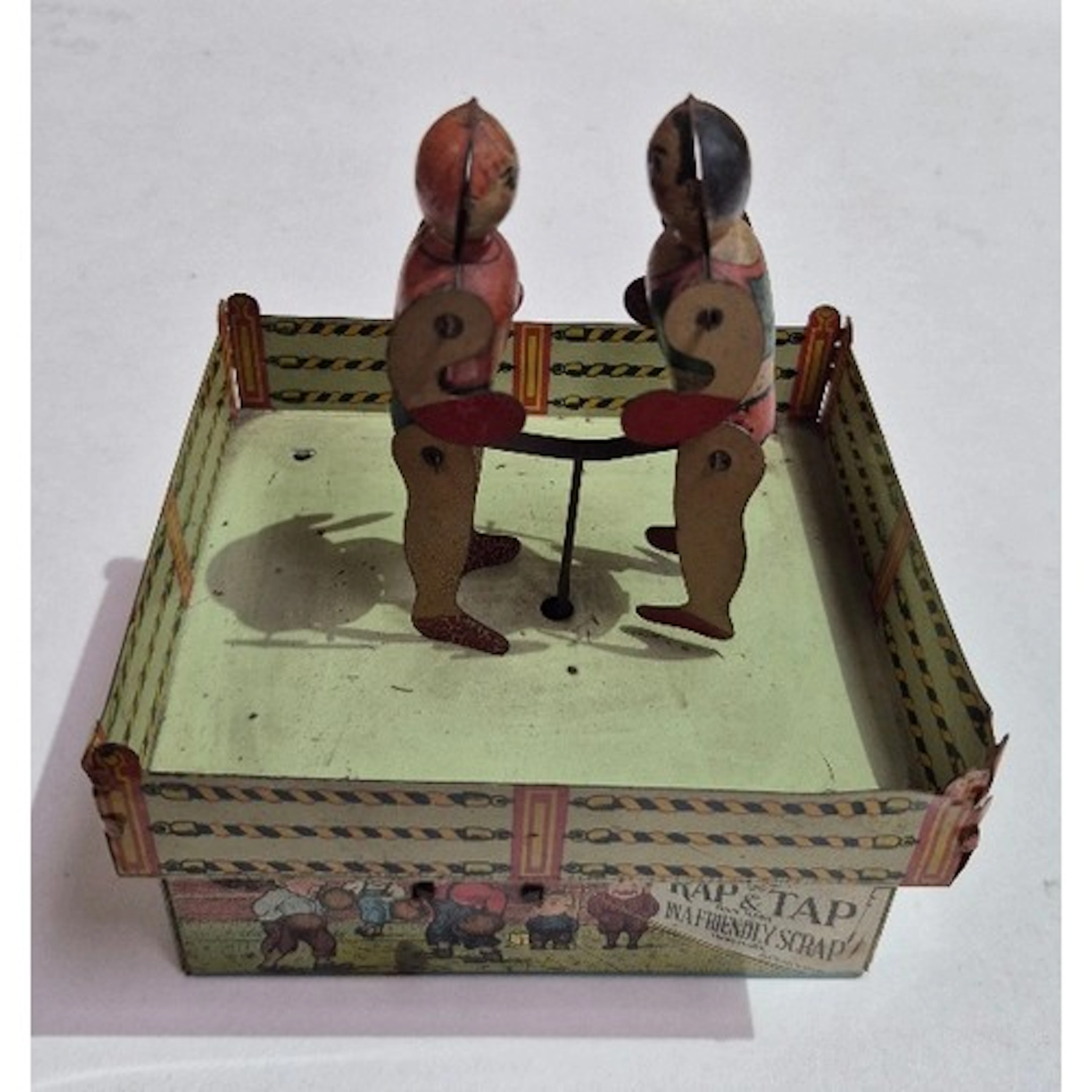 A Unique Art tin clockwork Rap & Tap boxing toy.