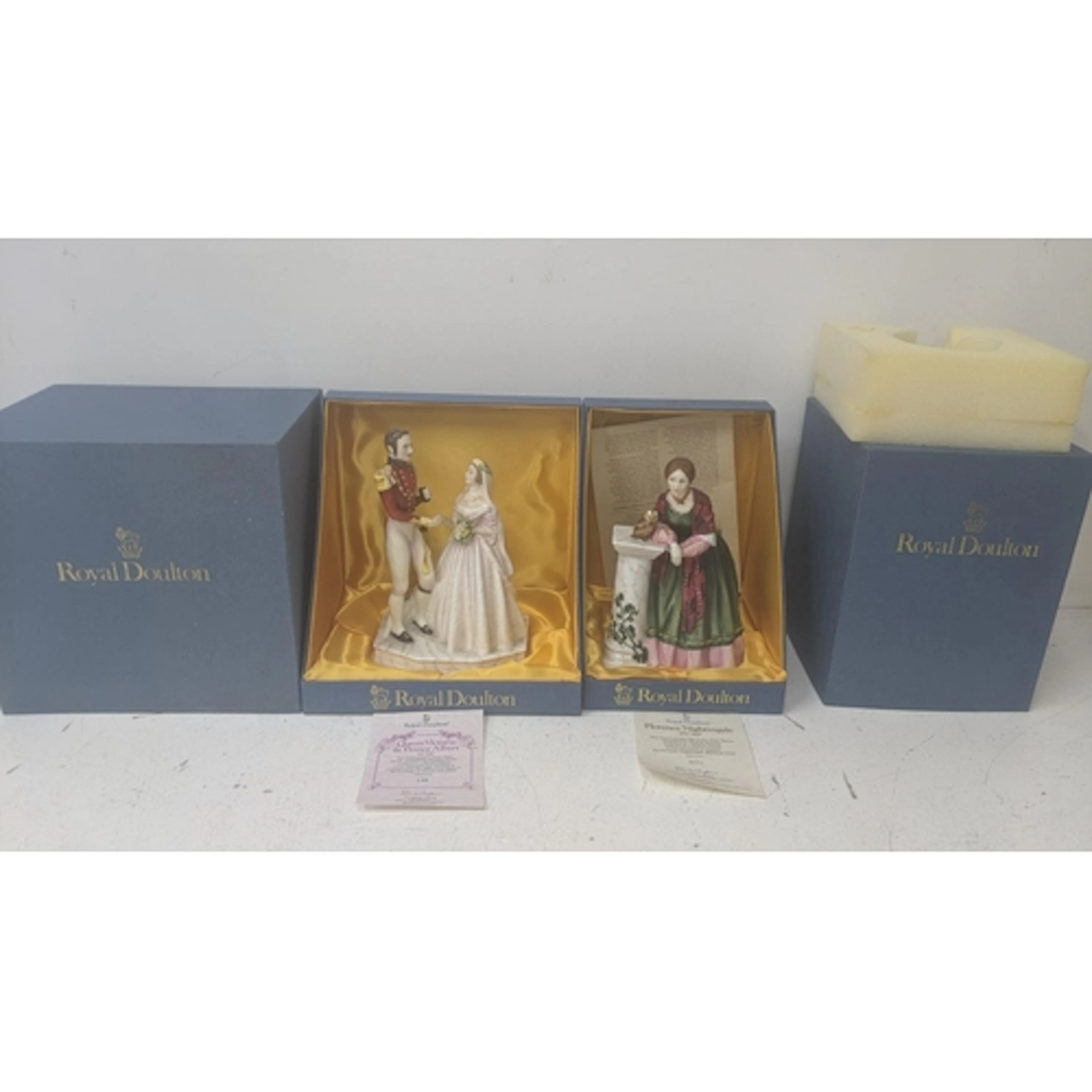 A boxed Royal Doulton HN3256 Queen Victoria and Prince Alber...