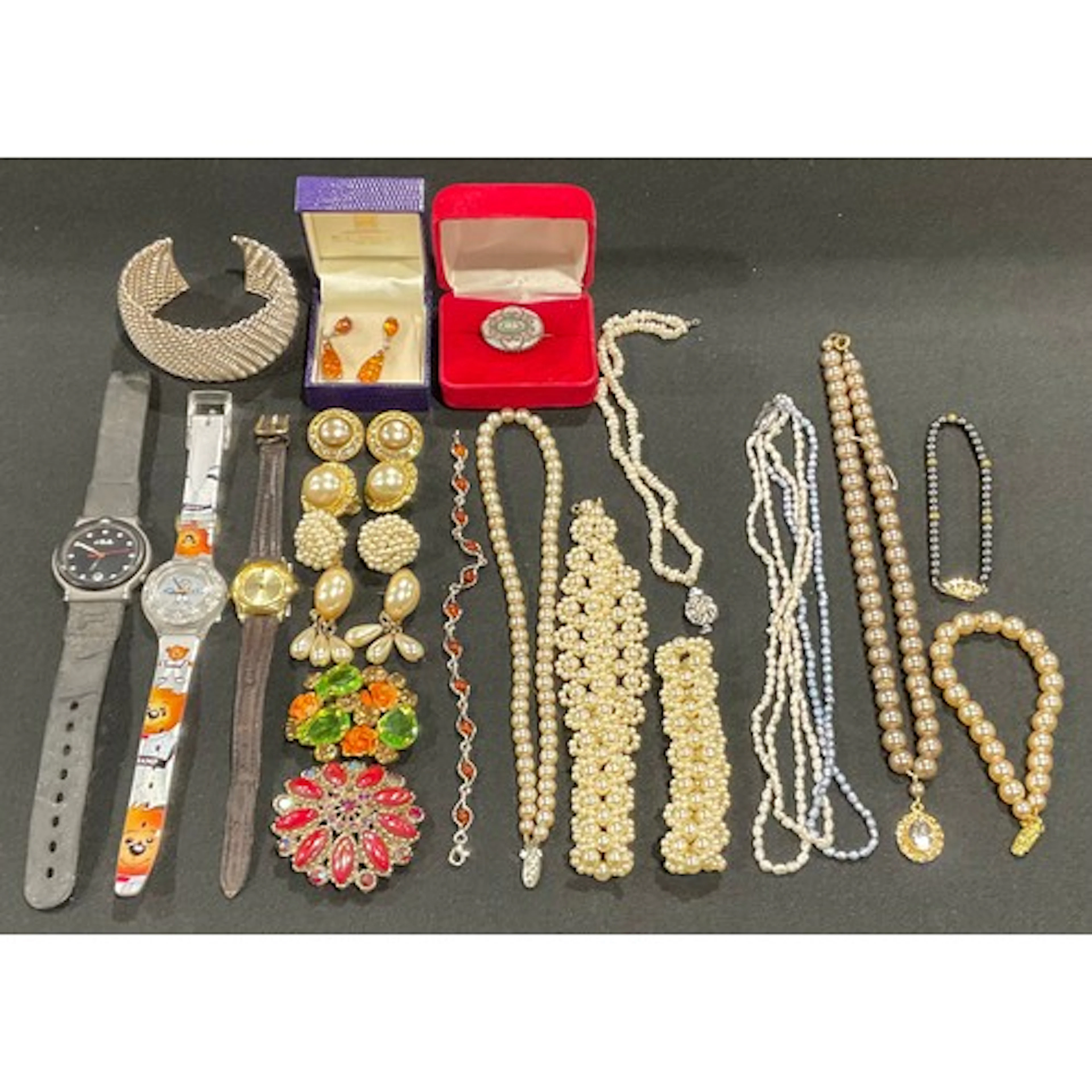 A selection of silver and costume jewellery and quartz wrist...
