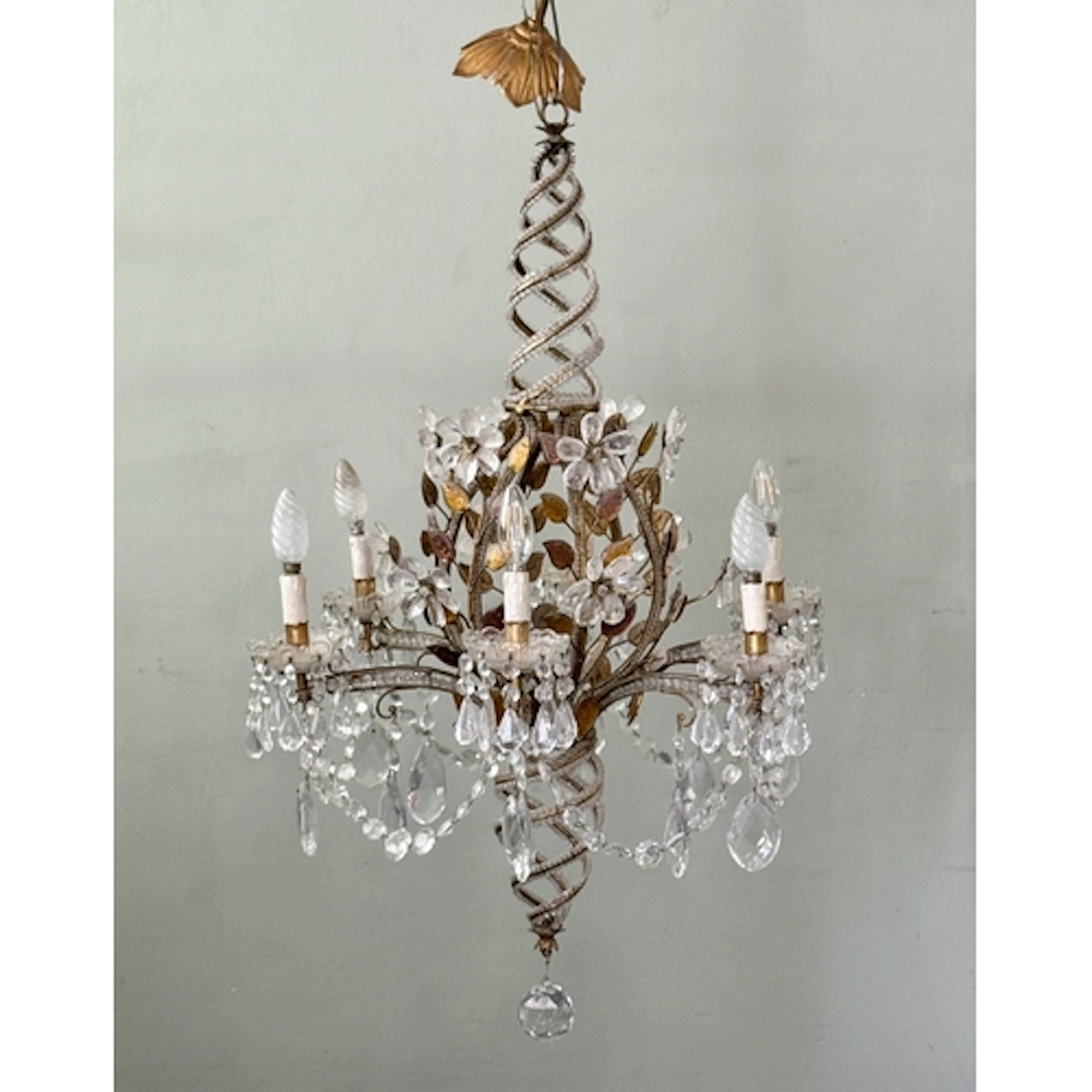 A gilt metal and coloured and cut glass six light chandelier...