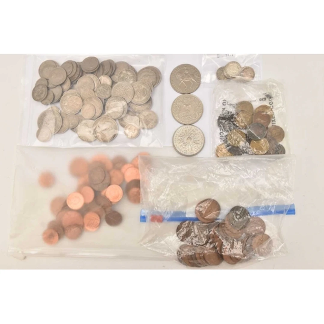 A box containing bagged quantities of coins. A bag of pre-de...