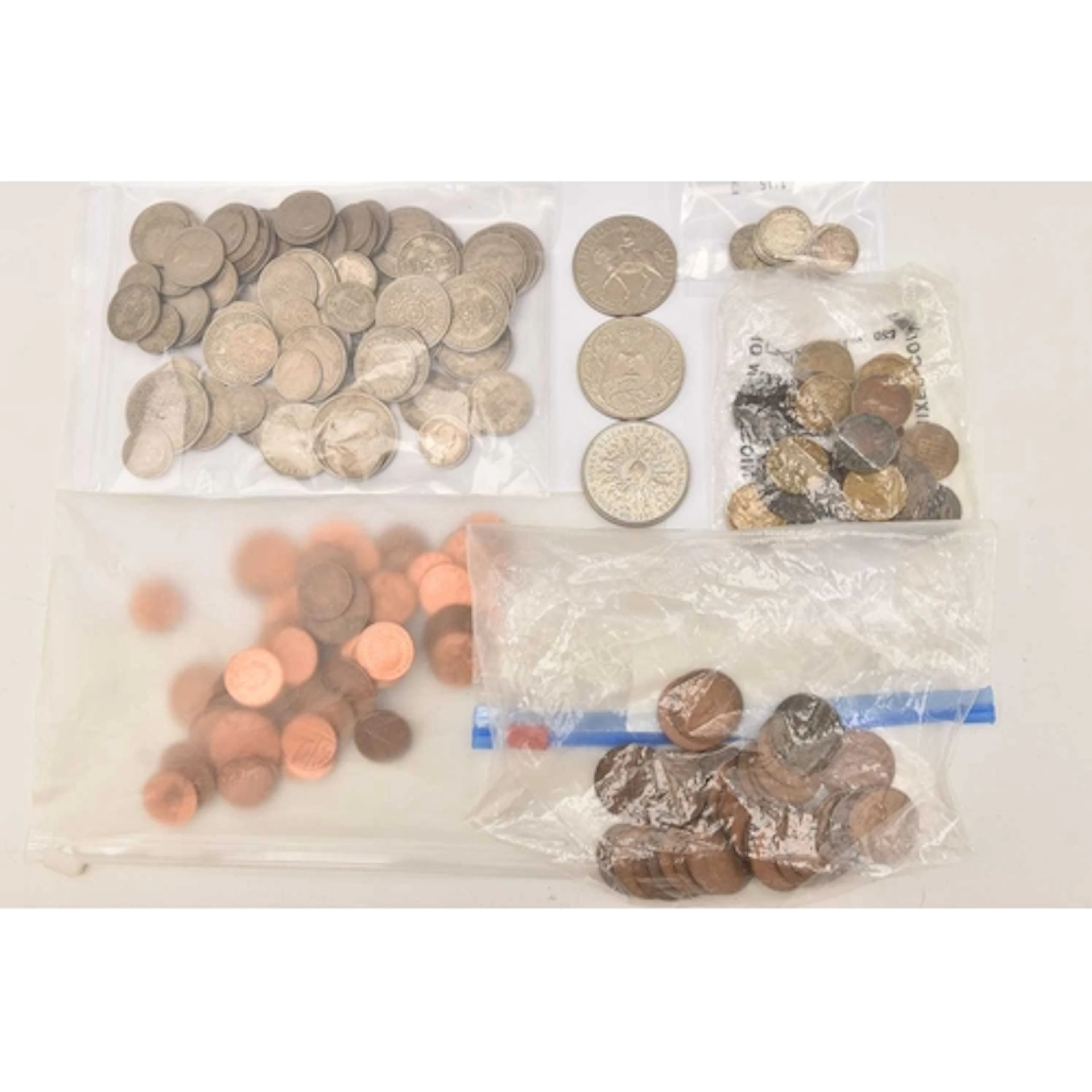 A box containing bagged quantities of coins. A bag of pre-de...