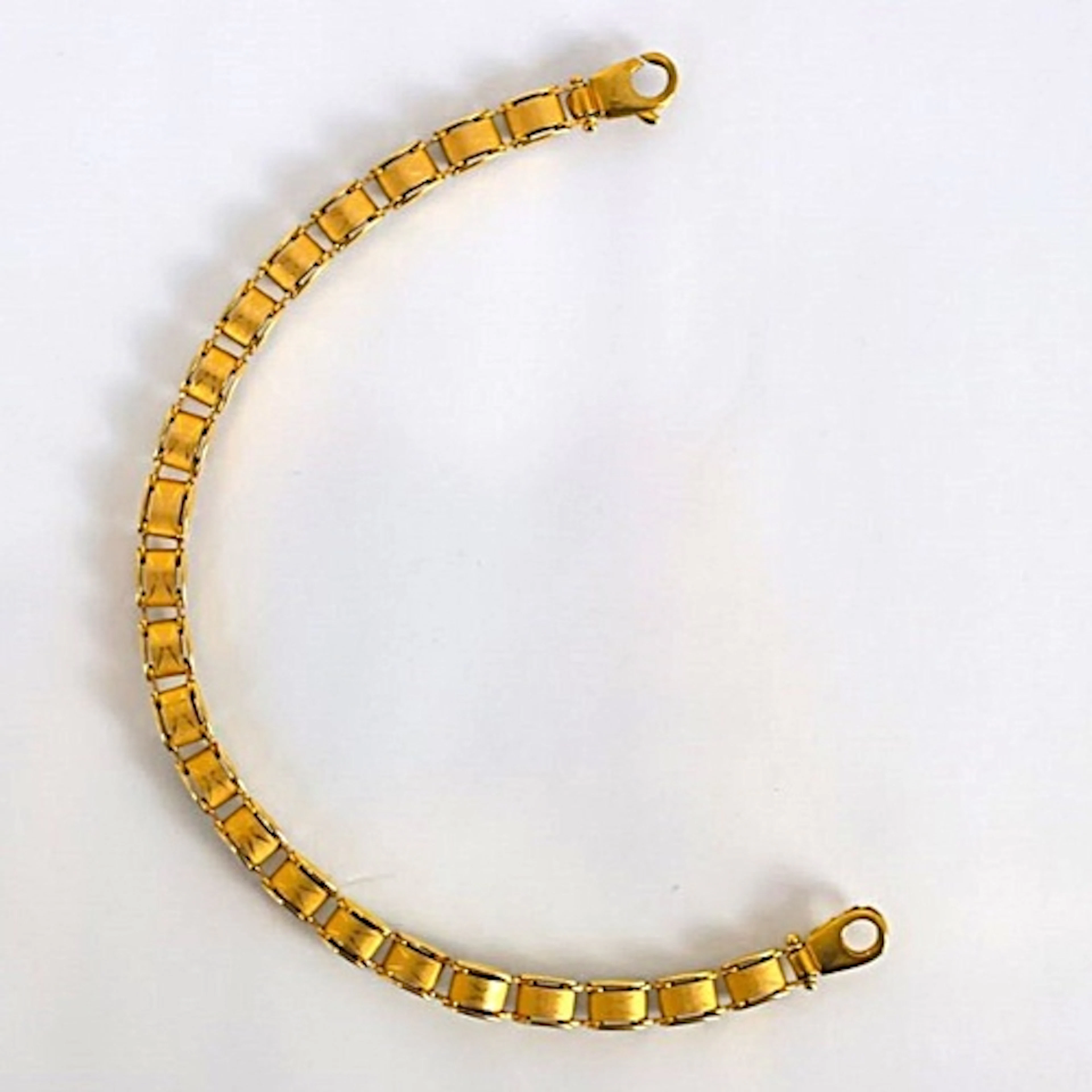 A contemporary Italian 9ct gold bracelet, the openwork desig...
