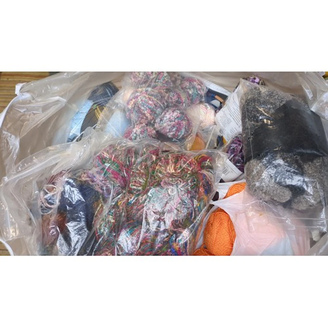 A quantity of knitting yarns in assorted colours and texture...