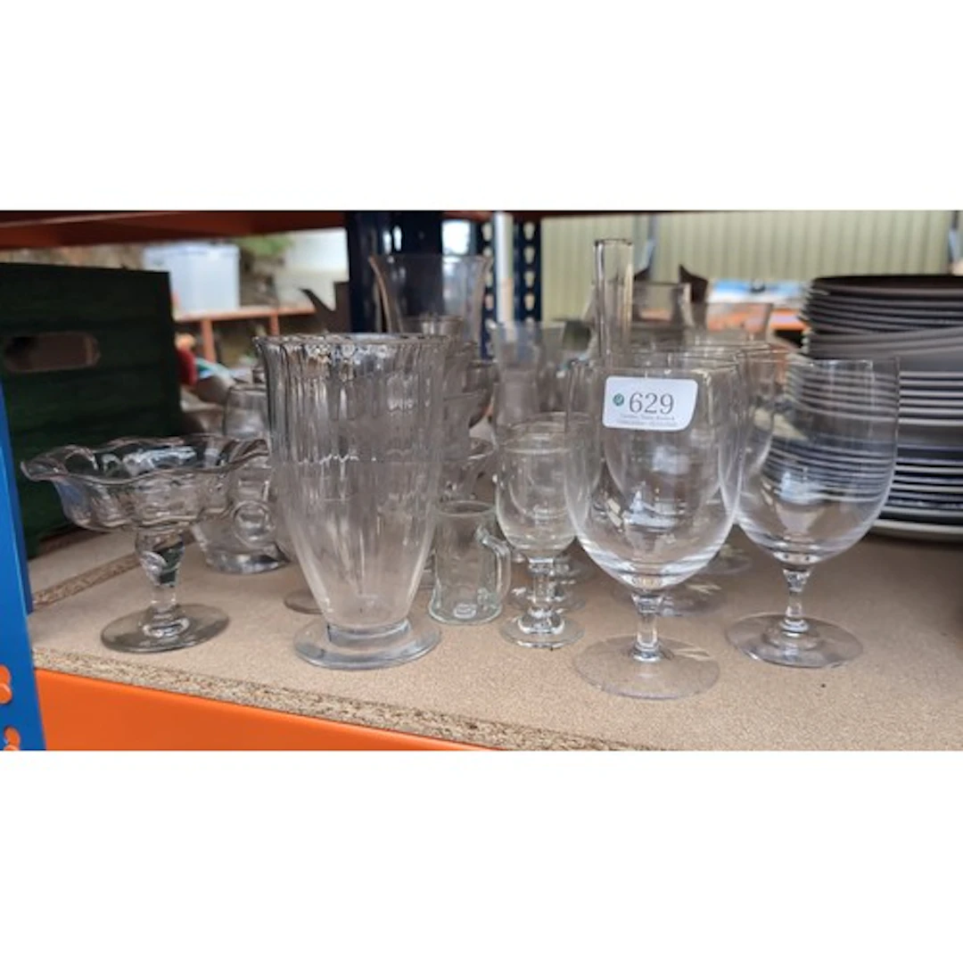 A quantity of assorted clear glass tableware, including stem...