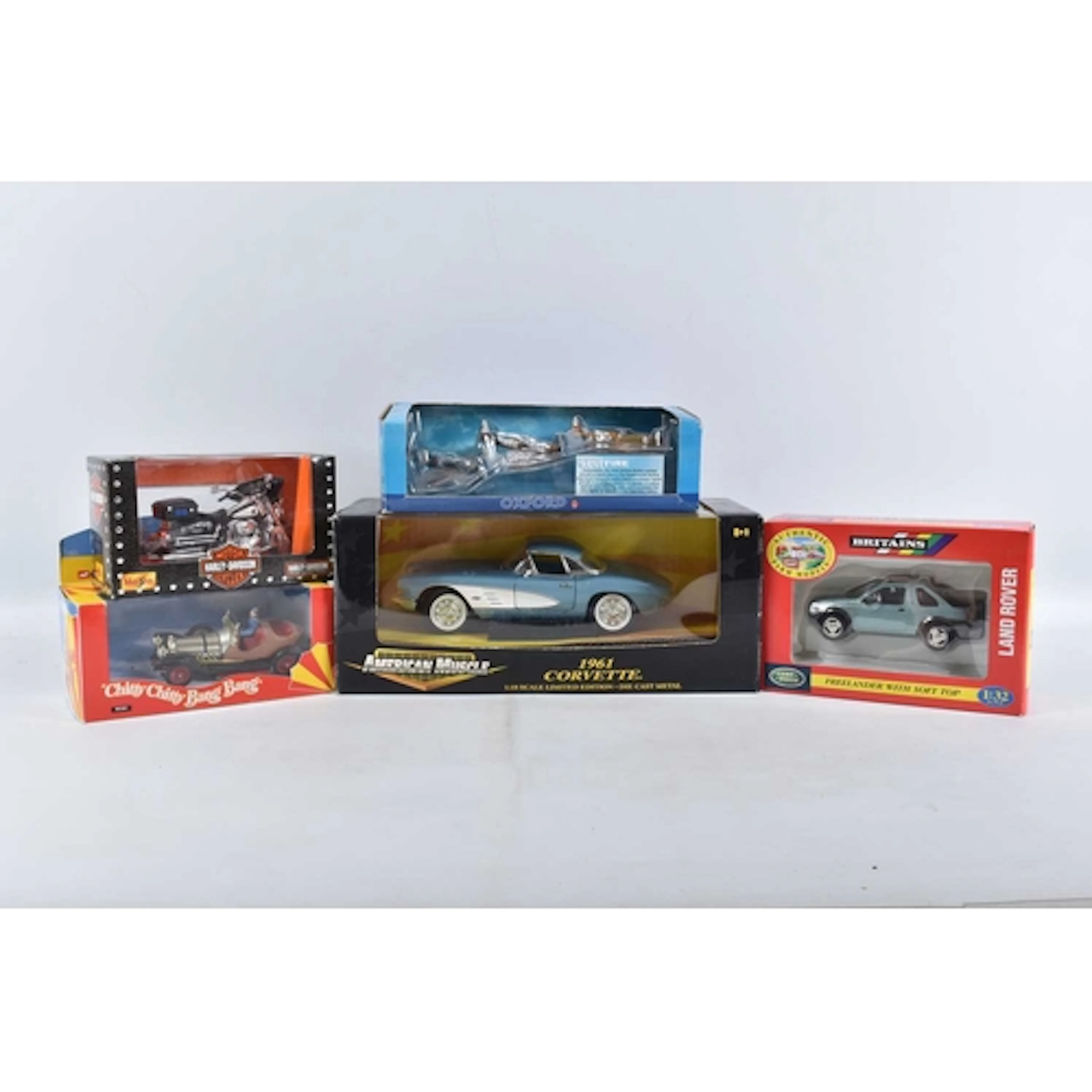 FIVE BOXED DIECAST MODEL VEHICLES, to include a boxed Americ...
