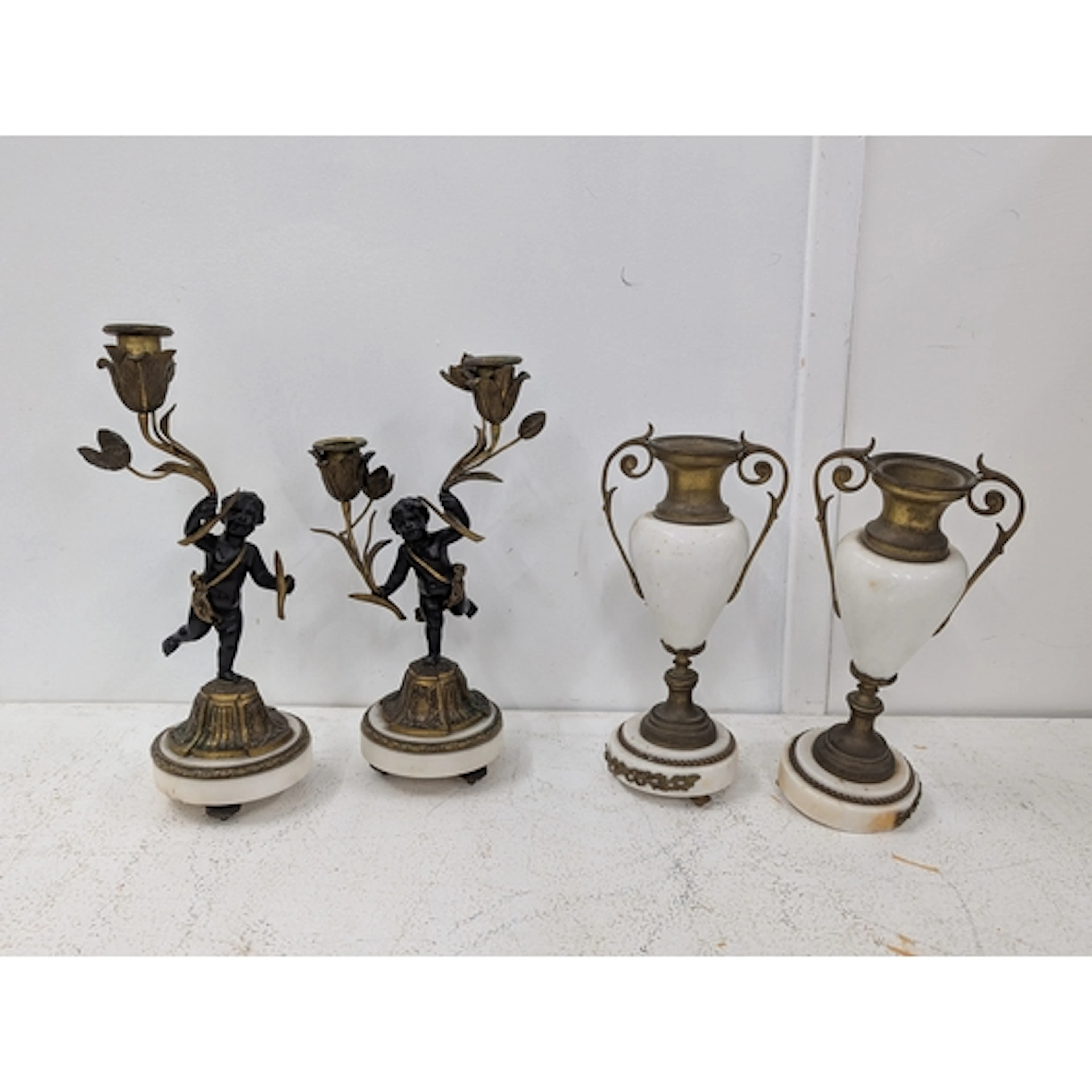 A pair of vintage French style candelabra fashioned as cheru...