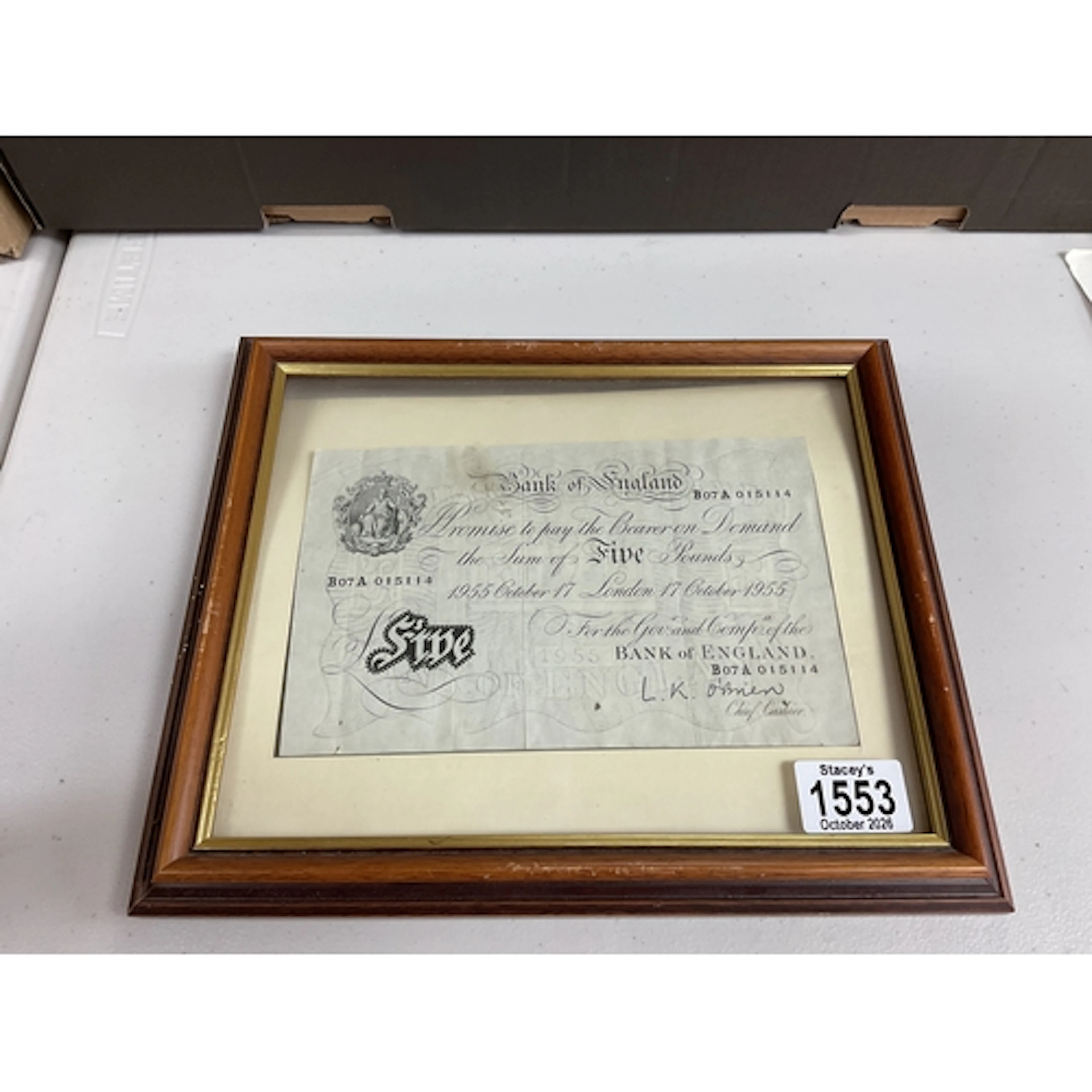 Framed and glazed 1955 L K OBrien white fiver.