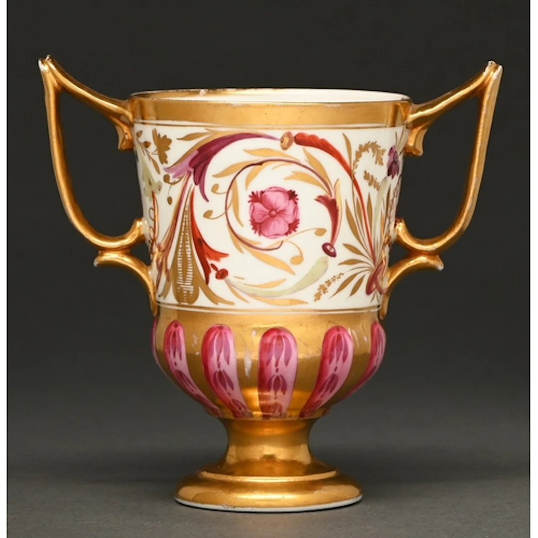 A Derby pedestal cabinet cup, c1810, painted in the Grecian ...