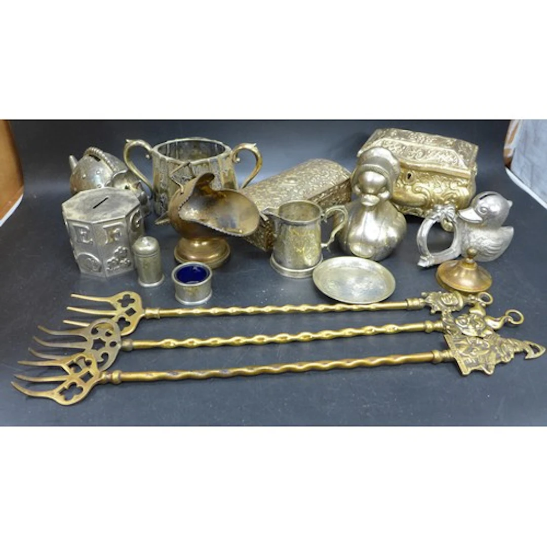 A collection of silver plated ware and brass including a cas...