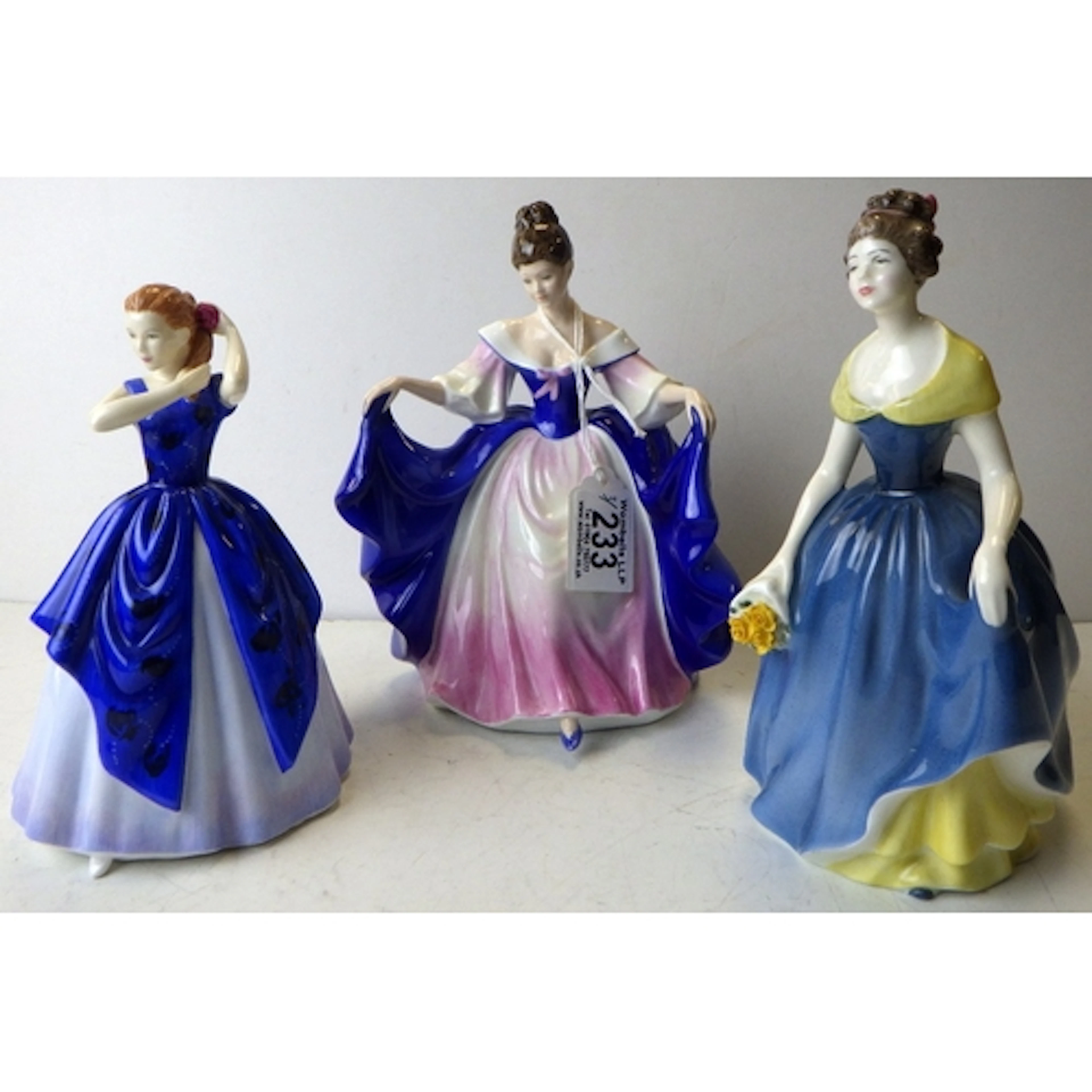 A group of three Royal Doulton figurines