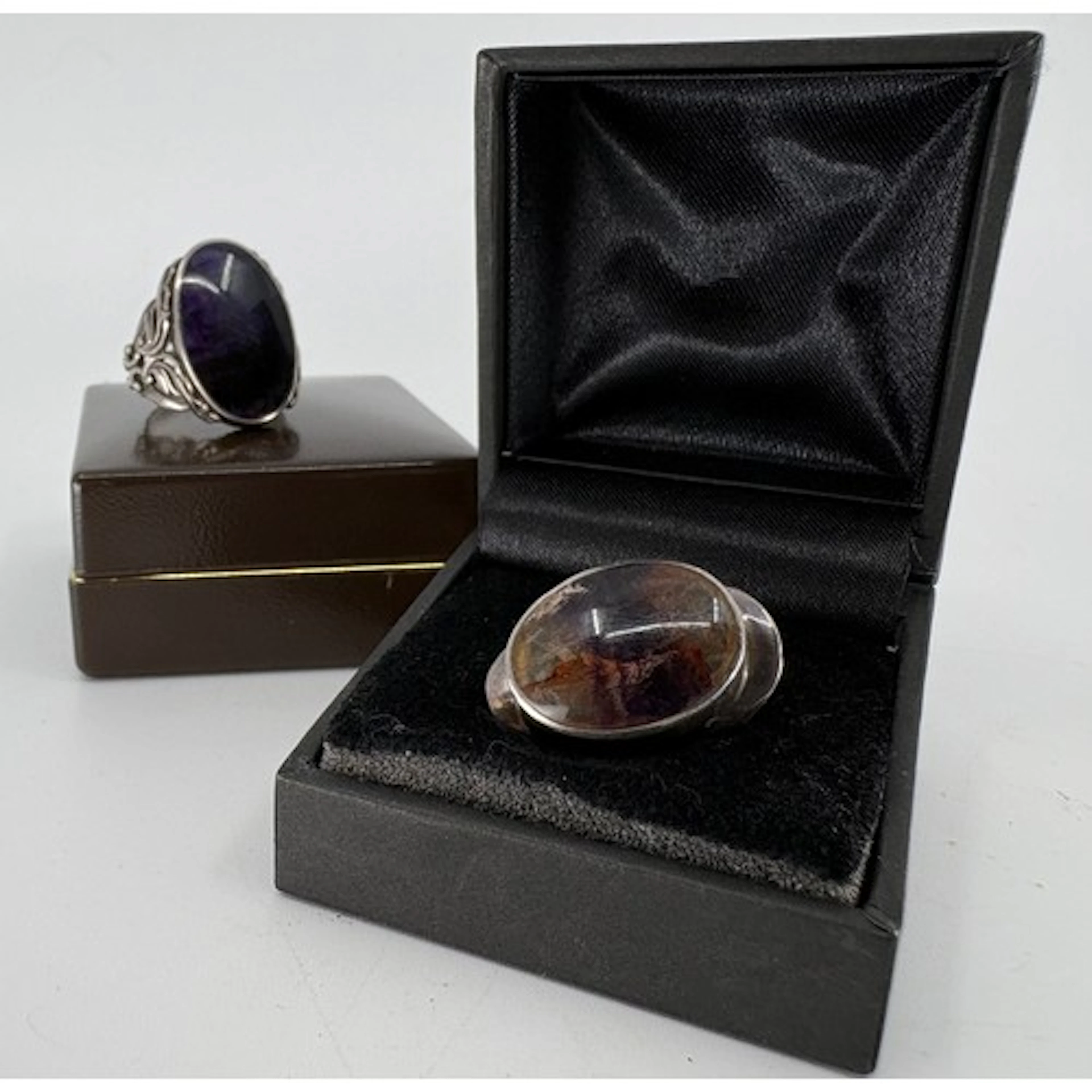 Two hallmarked silver mounted blue john oval rings, one of t...