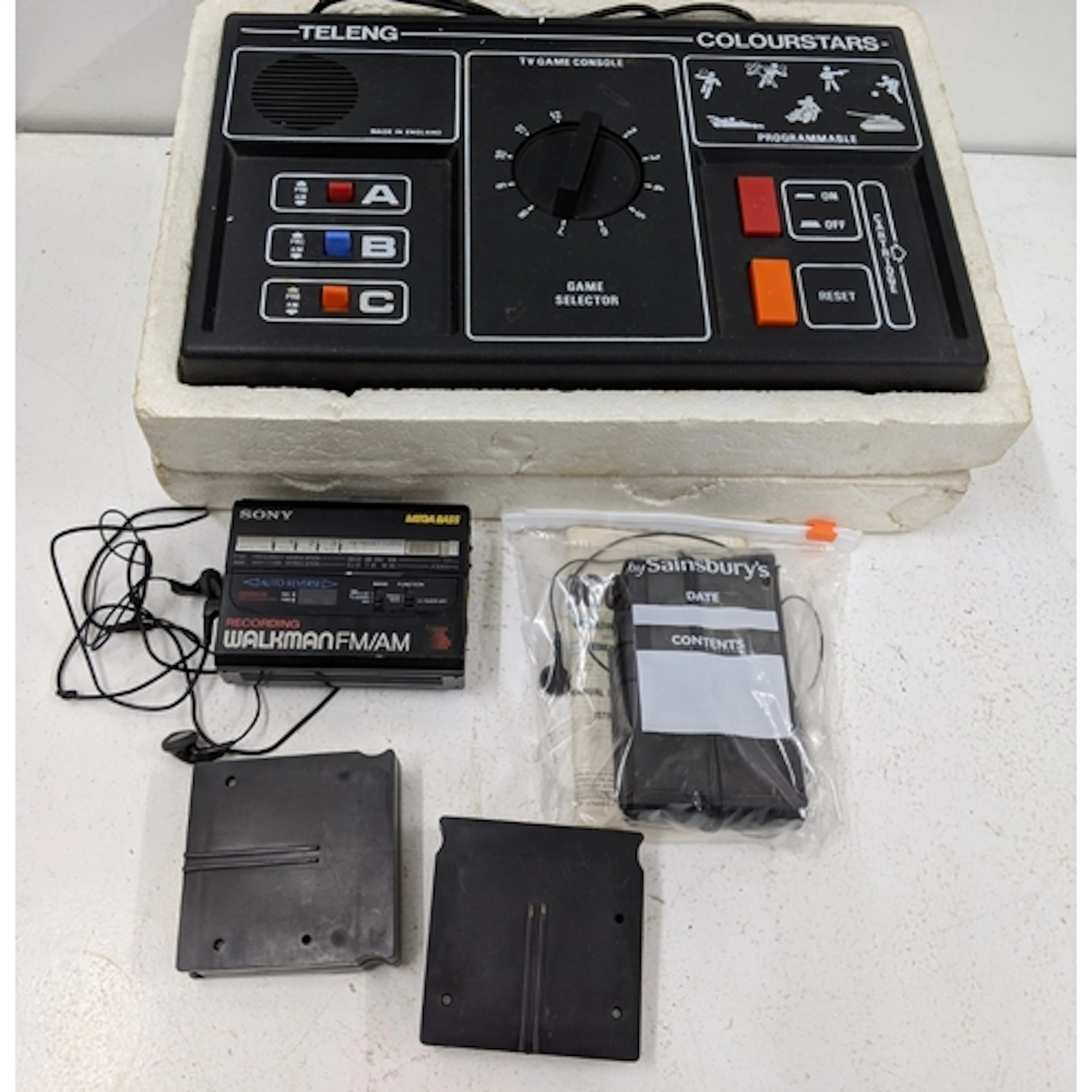 A Telang Colourstars gaming console, along with a Sony Walkm...