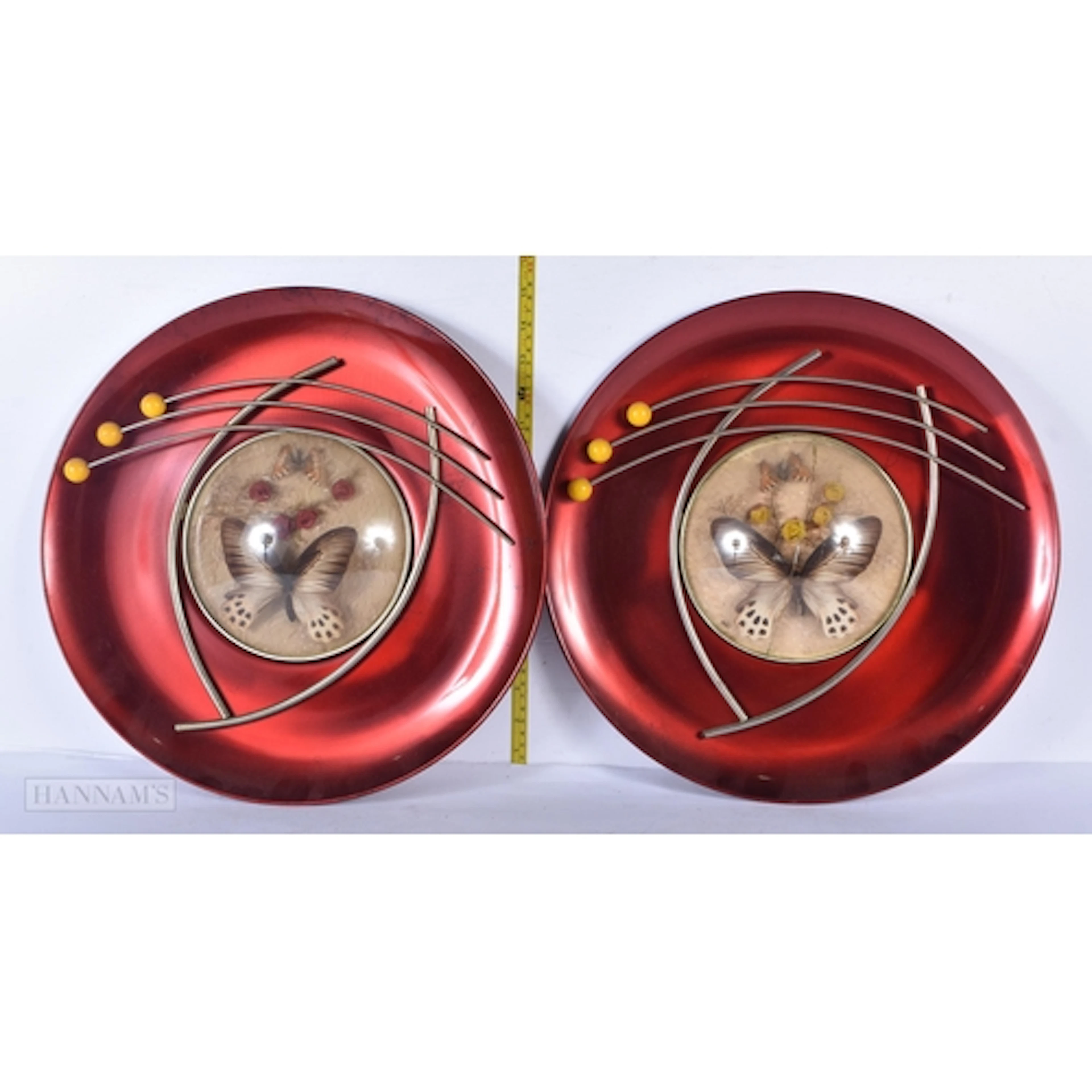 A pair of Mid Century metallic wall art display with a centr...