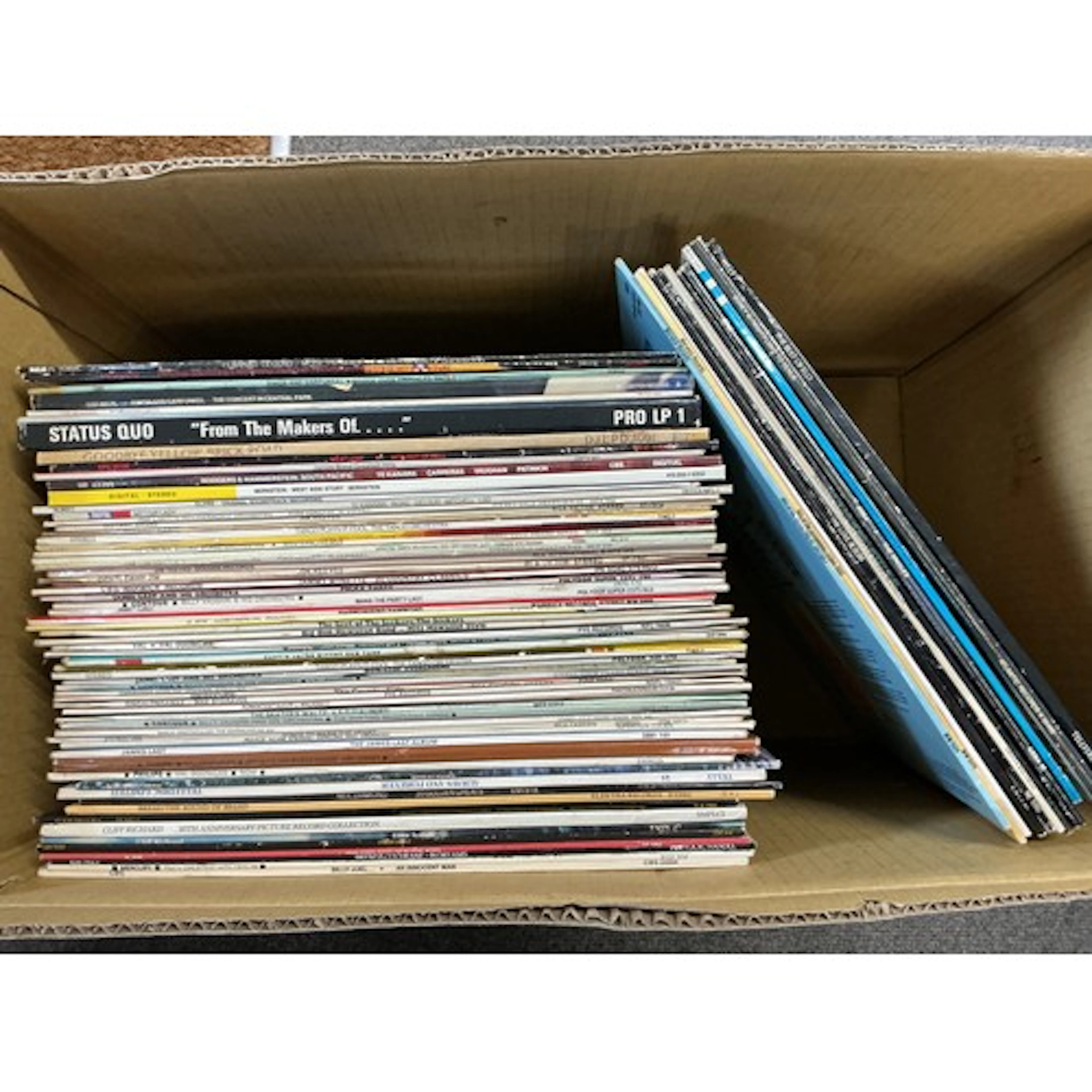 A collection of LPs by various artists including Elton John,...