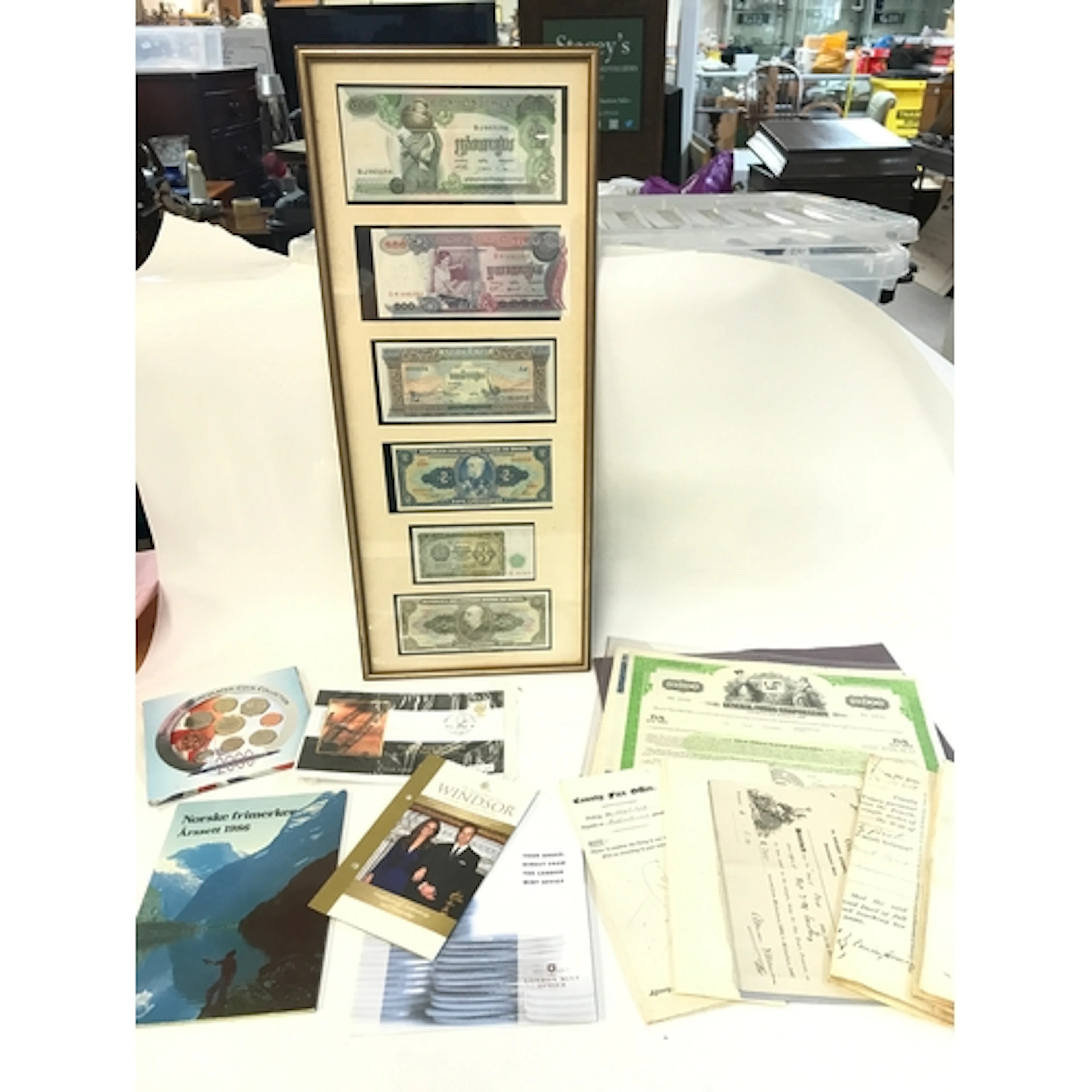 Framed bank notes , coins and bonds. No reserve