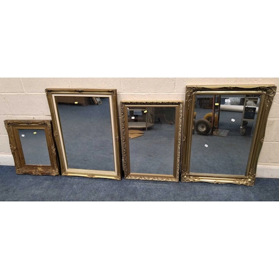 FOUR GILT FRAMED WALL MIRRORS, varying in size, style, patte...