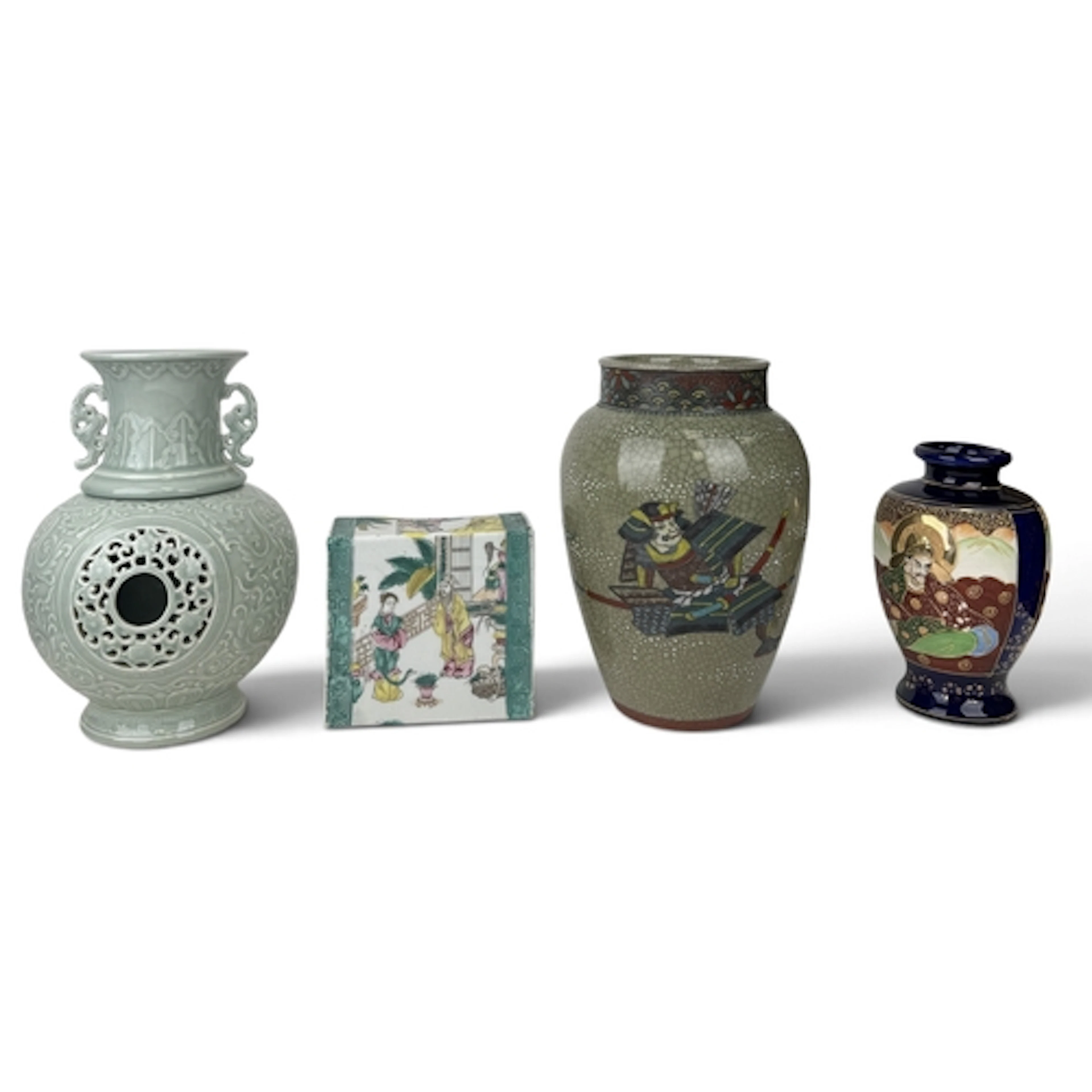 A CHINESE RETICULATED CELADON VASE Sectional, in two parts, ...